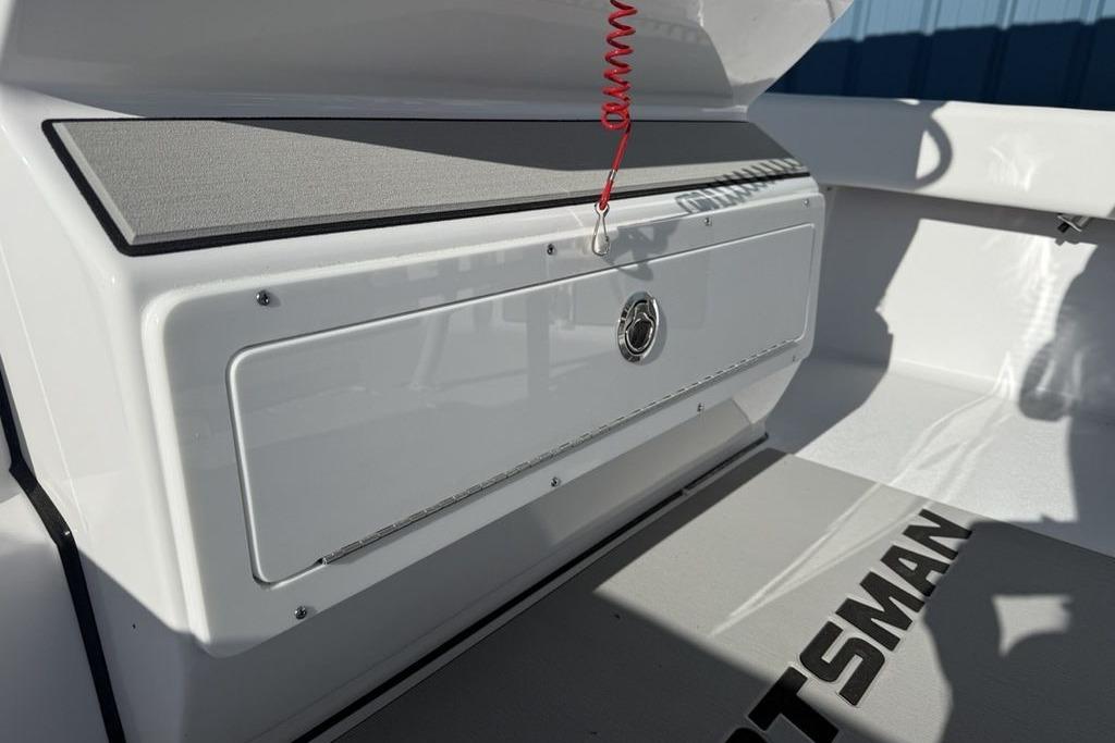 2026 Sportsman Masters 247OE Bay Boat interior with storage compartment and branding.