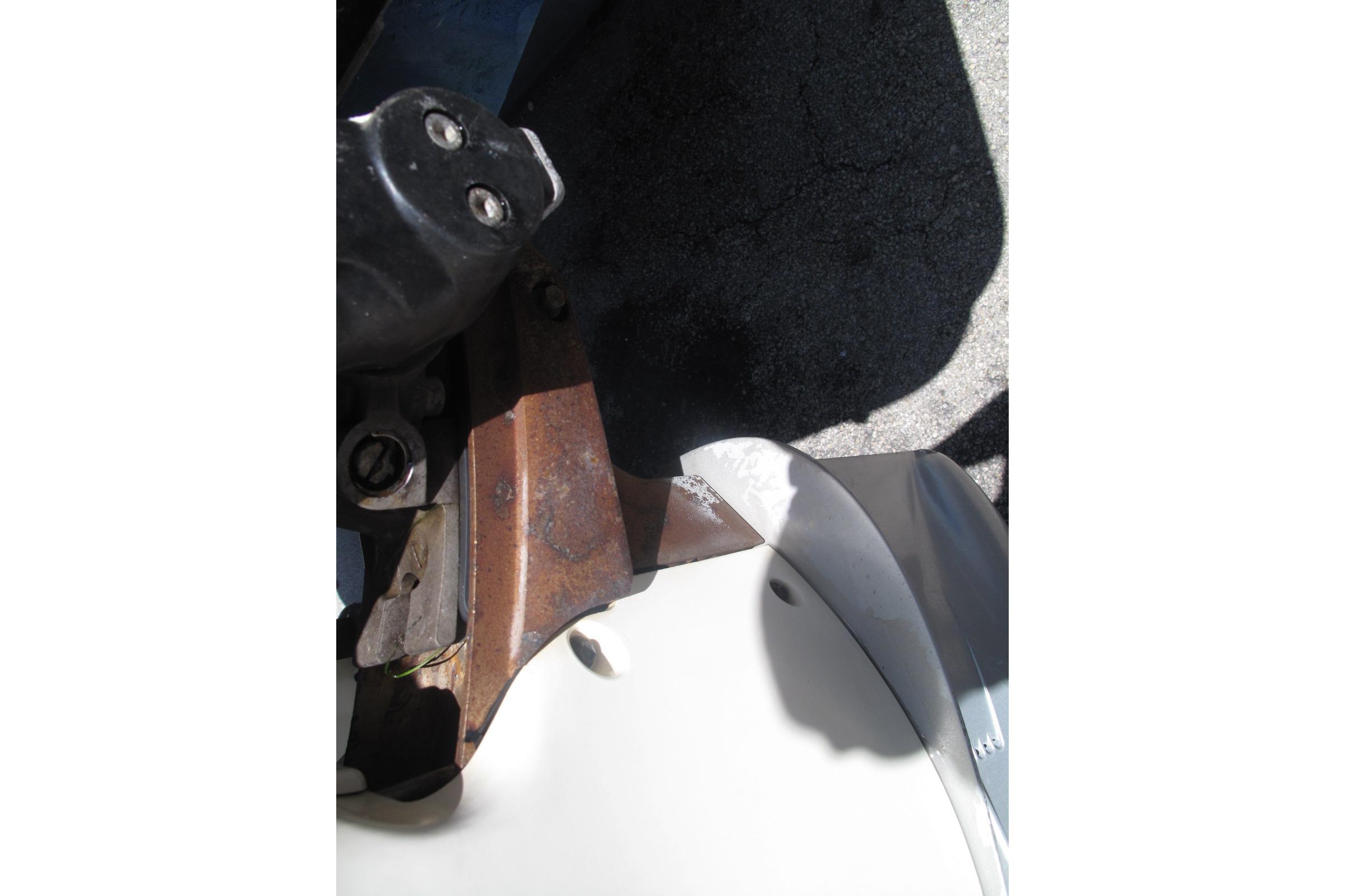 Close-up of a 2017 SeaVee 340B boat component with visible rust and shadow.
