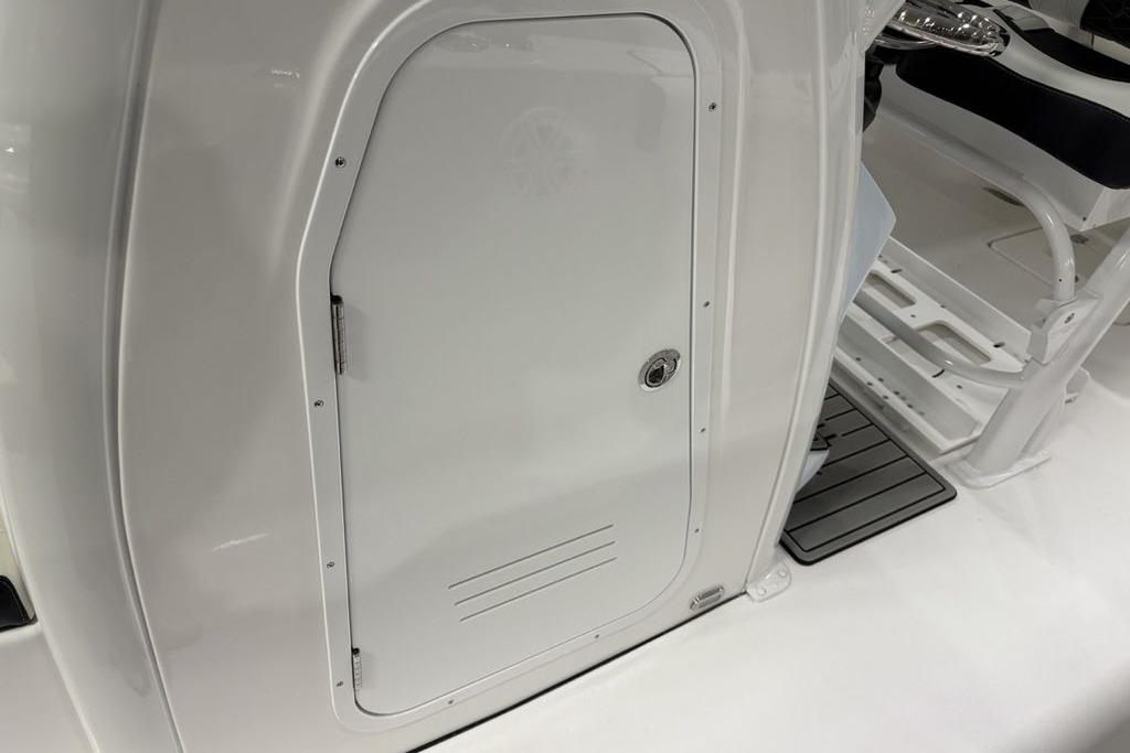 2026 Tidewater 232 CC Adventure boat interior, featuring a sleek white storage compartment.
