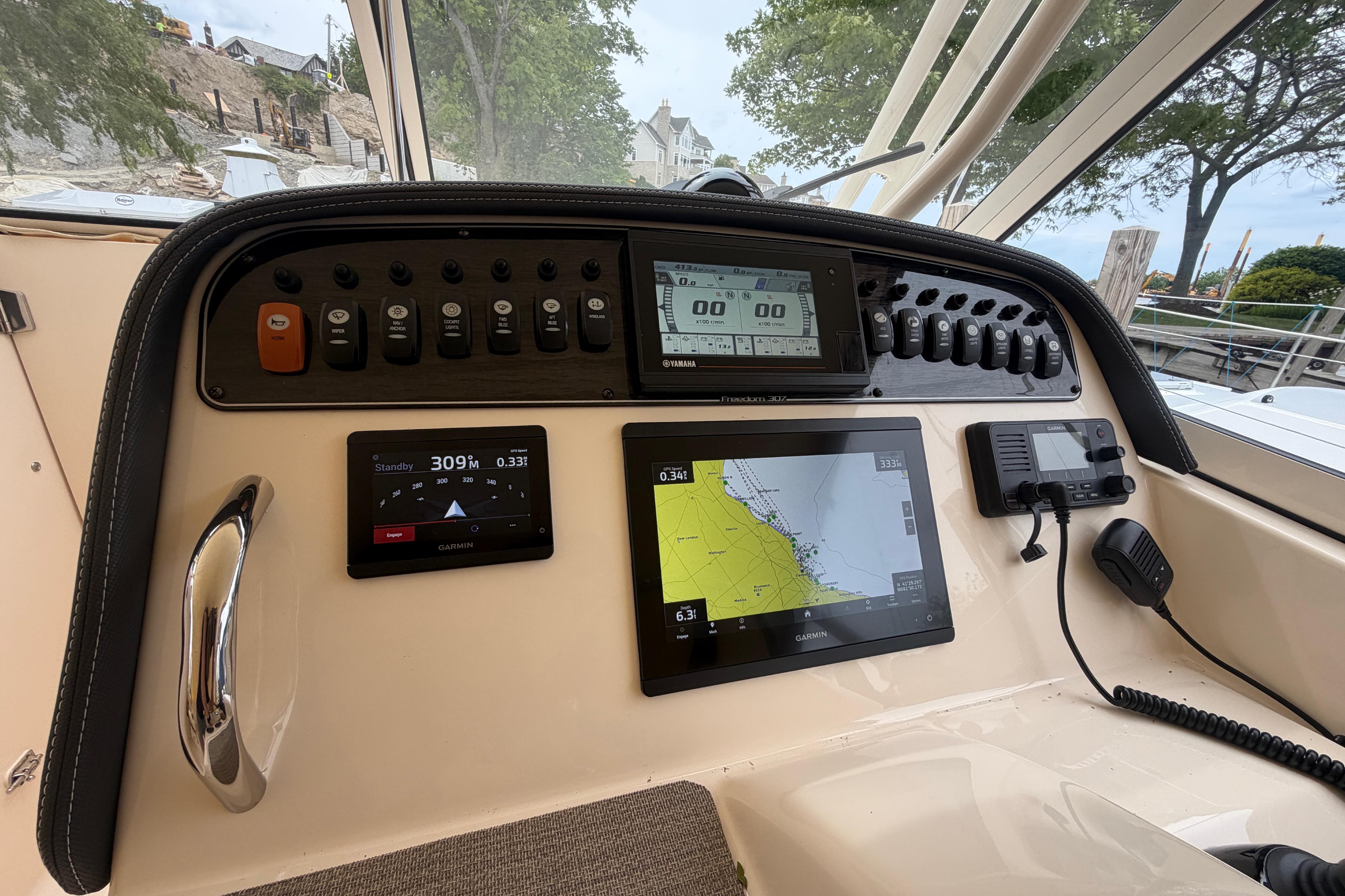 2019 Grady-White Freedom 307 boat dashboard with navigation and control systems.