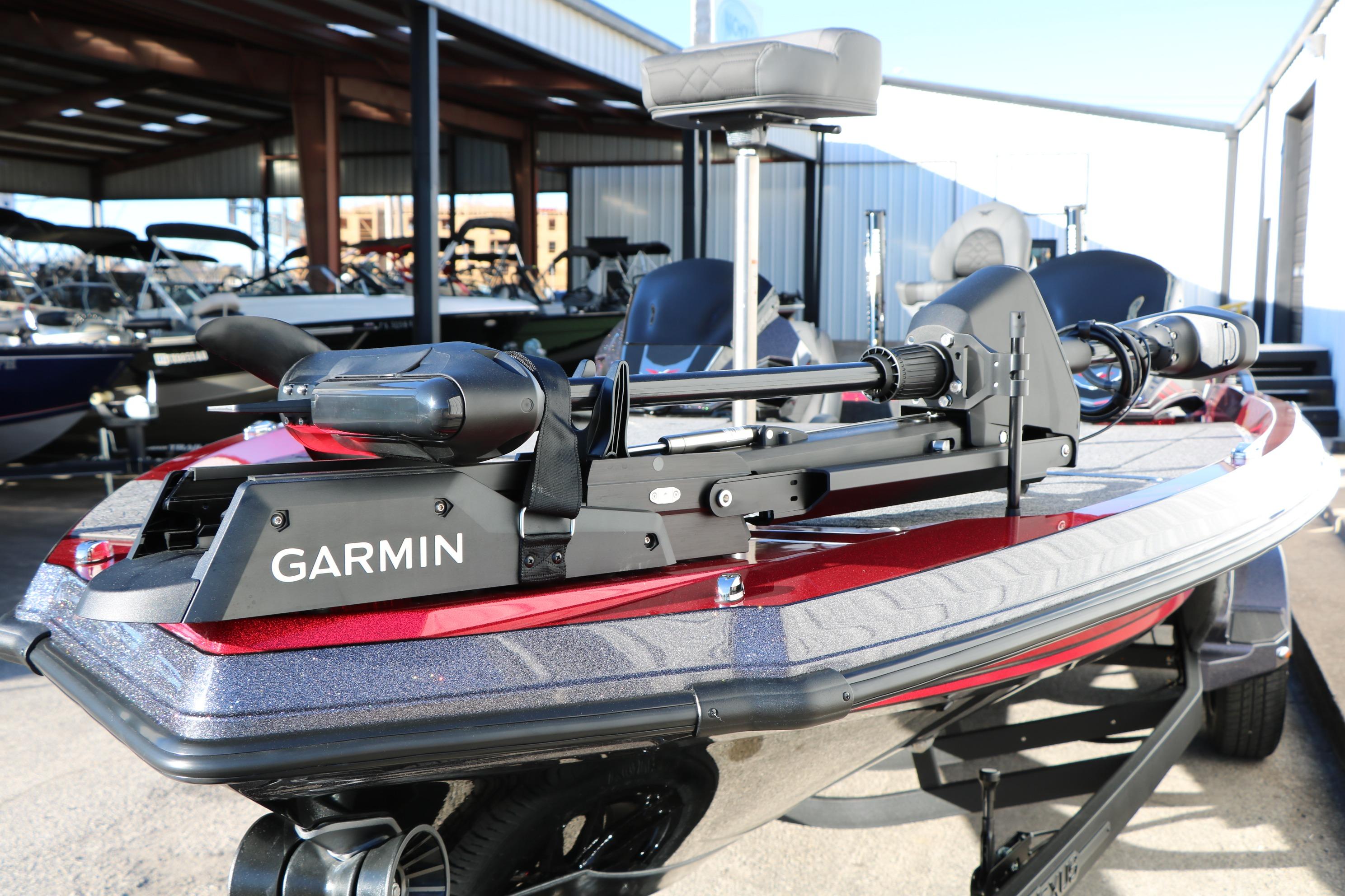 2026 Vexus VXs21 boat with Garmin equipment, parked in a marina setting.