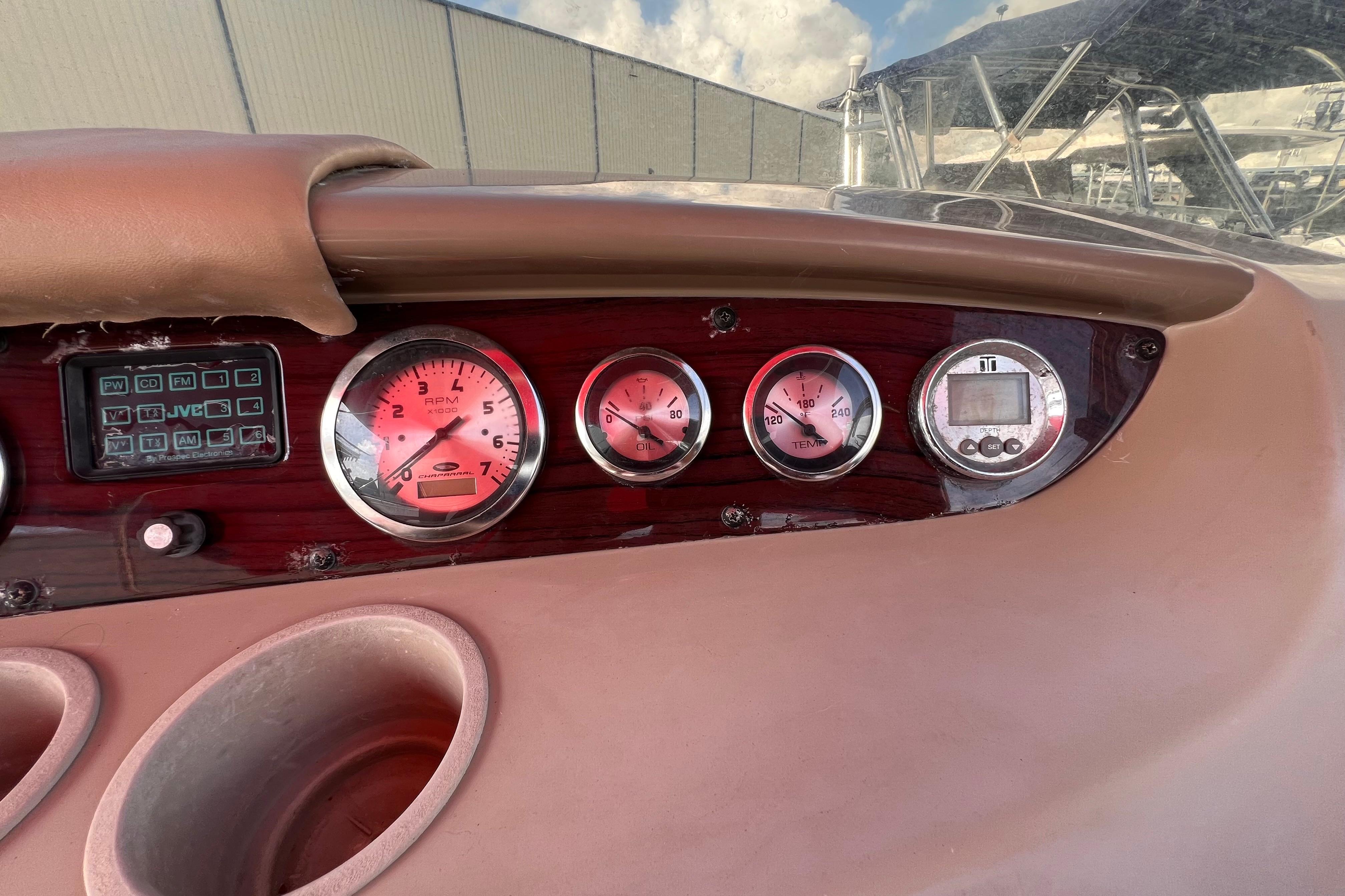 Dashboard of a 2002 Chaparral 232 Sunesta boat with gauges and controls.