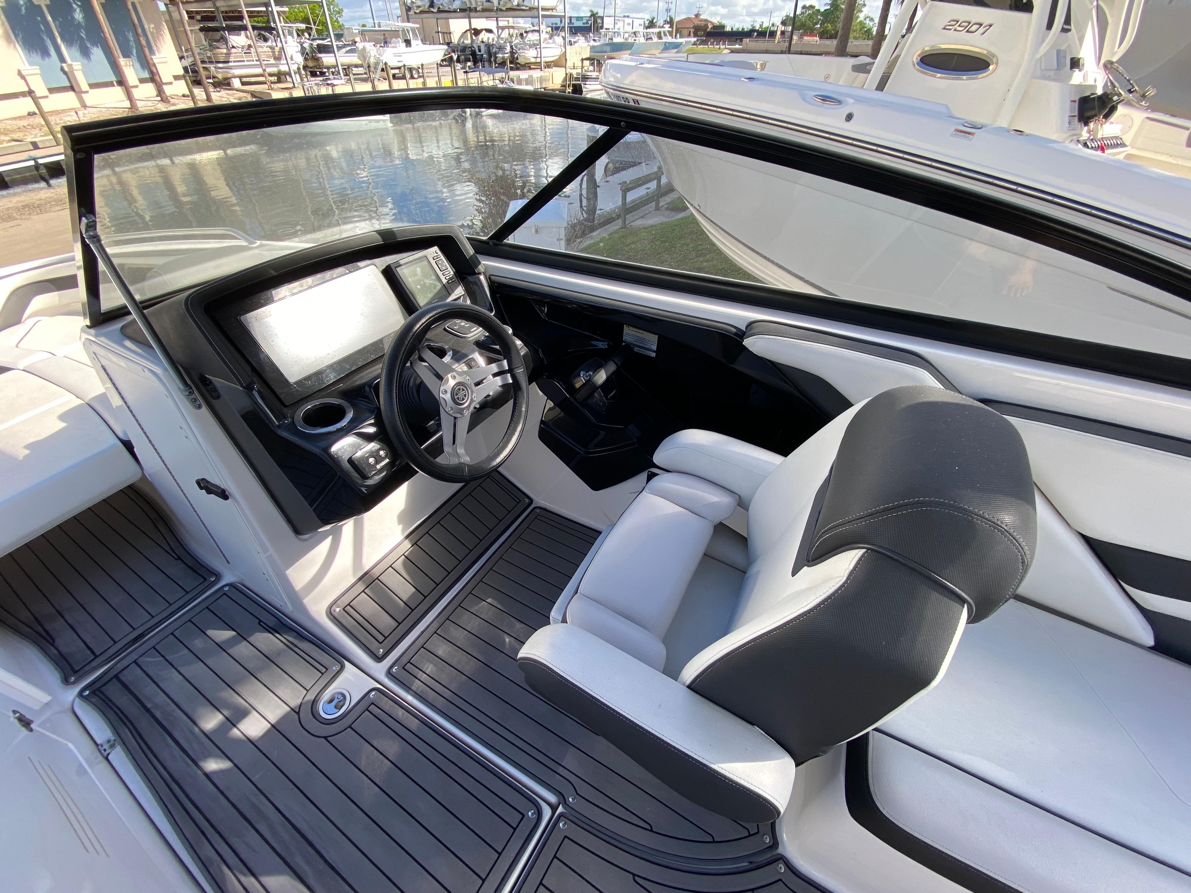 2018 Yamaha Boats 242 Limited S interior with sleek dashboard and comfortable seating.