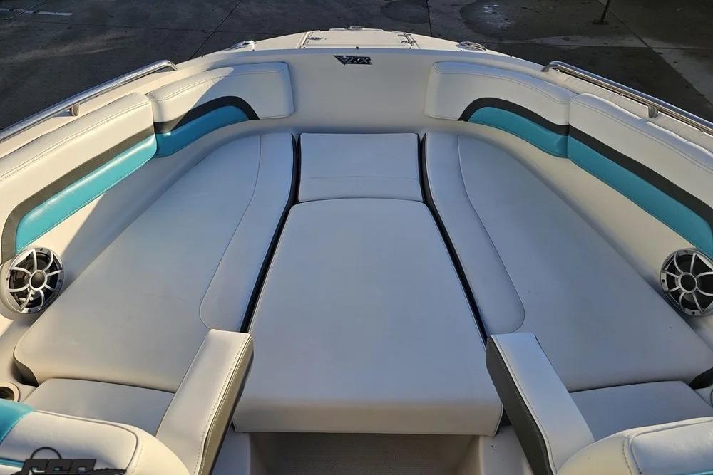 2016 CHAPPARRAL 243 boat interior with white and teal seating.