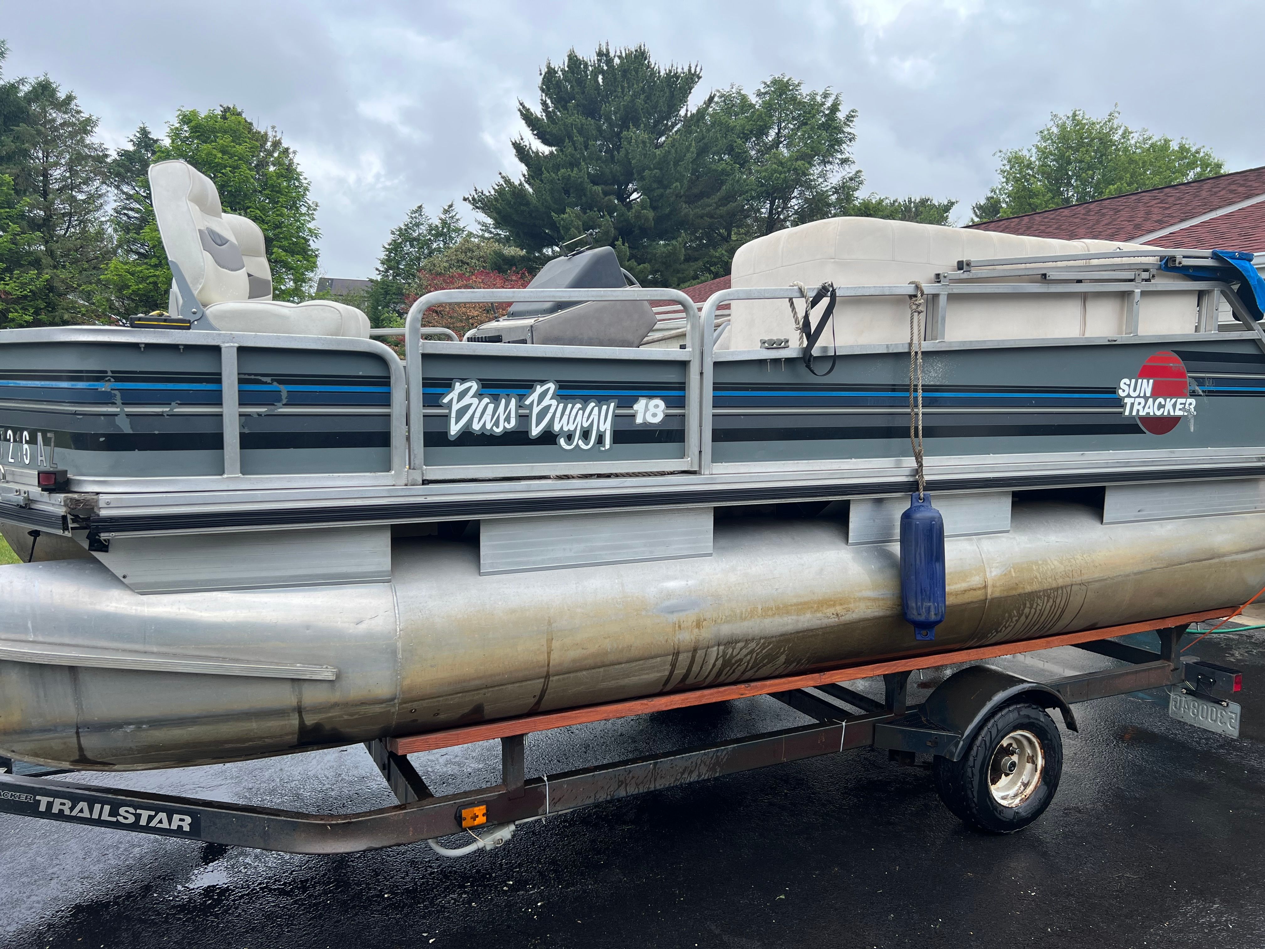 1991 Tracker Bass Buggy pontoon boat on trailer.