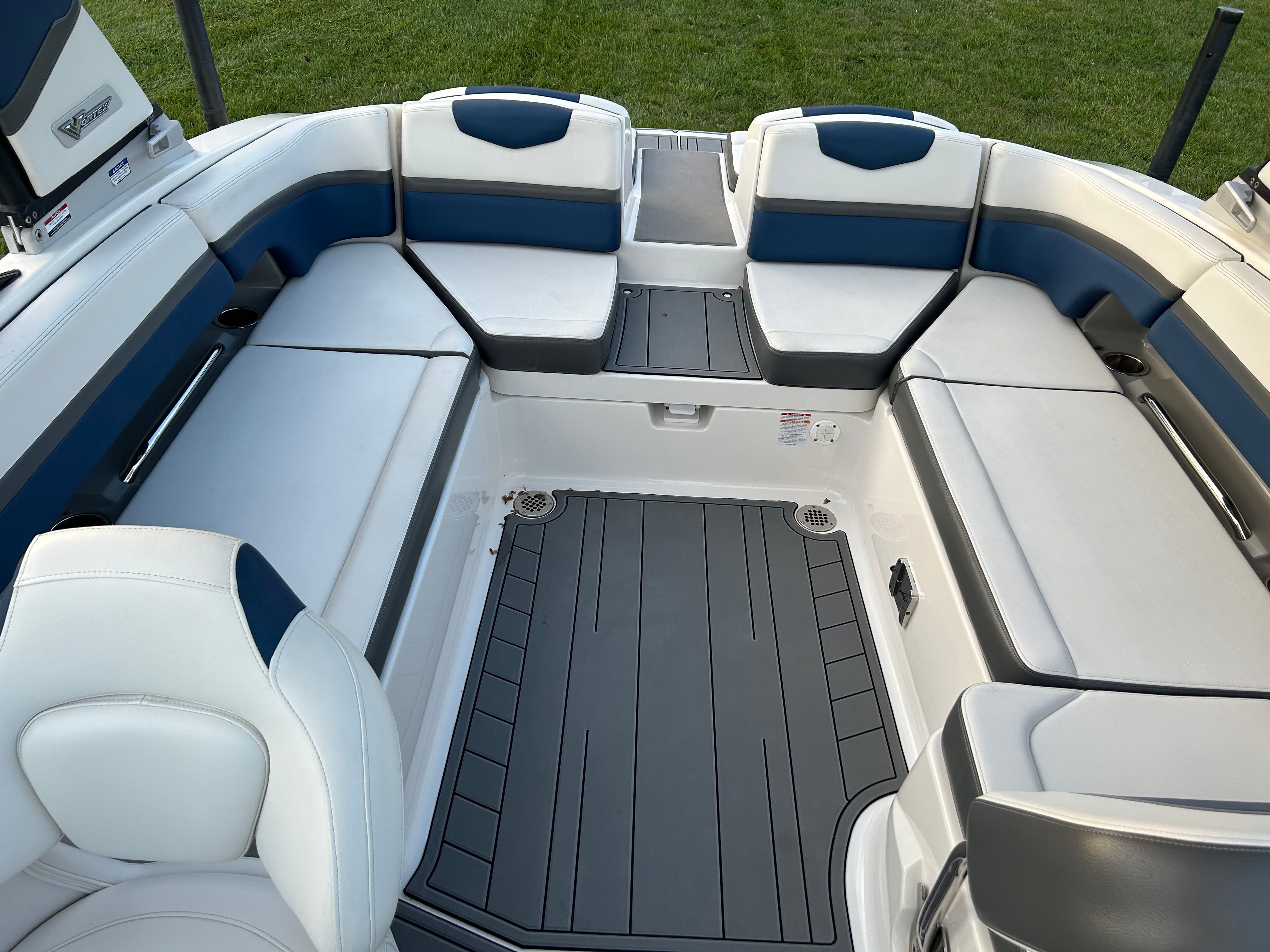 Interior of 2015 Chaparral Vortex 243 VRX with blue and white seating.