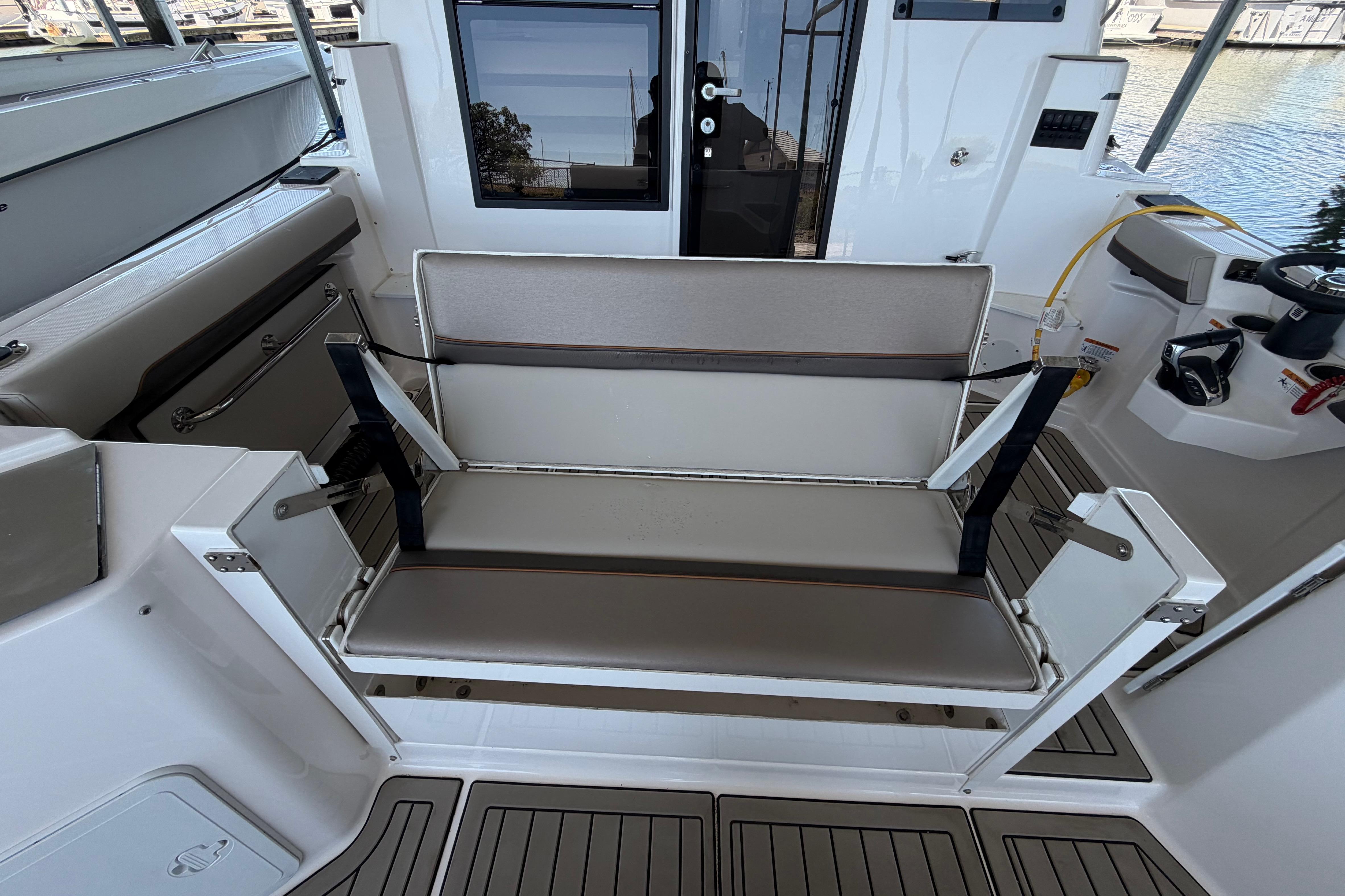 2023 Cutwater C-288 Coupe interior with foldable seating and modern design.