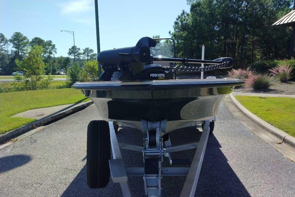 2026 Mako 18 Pro Skiff Backwater Edition on trailer, front view, outdoors.