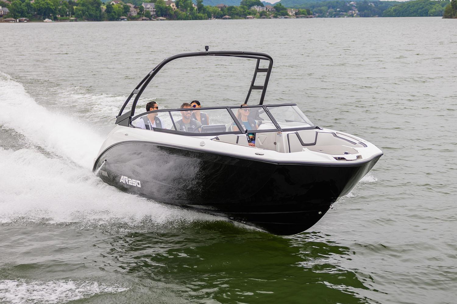 Manufacturer Provided Image: 2026 Yamaha Boats AR250 cruising on a lake with passengers enjoying the ride.
