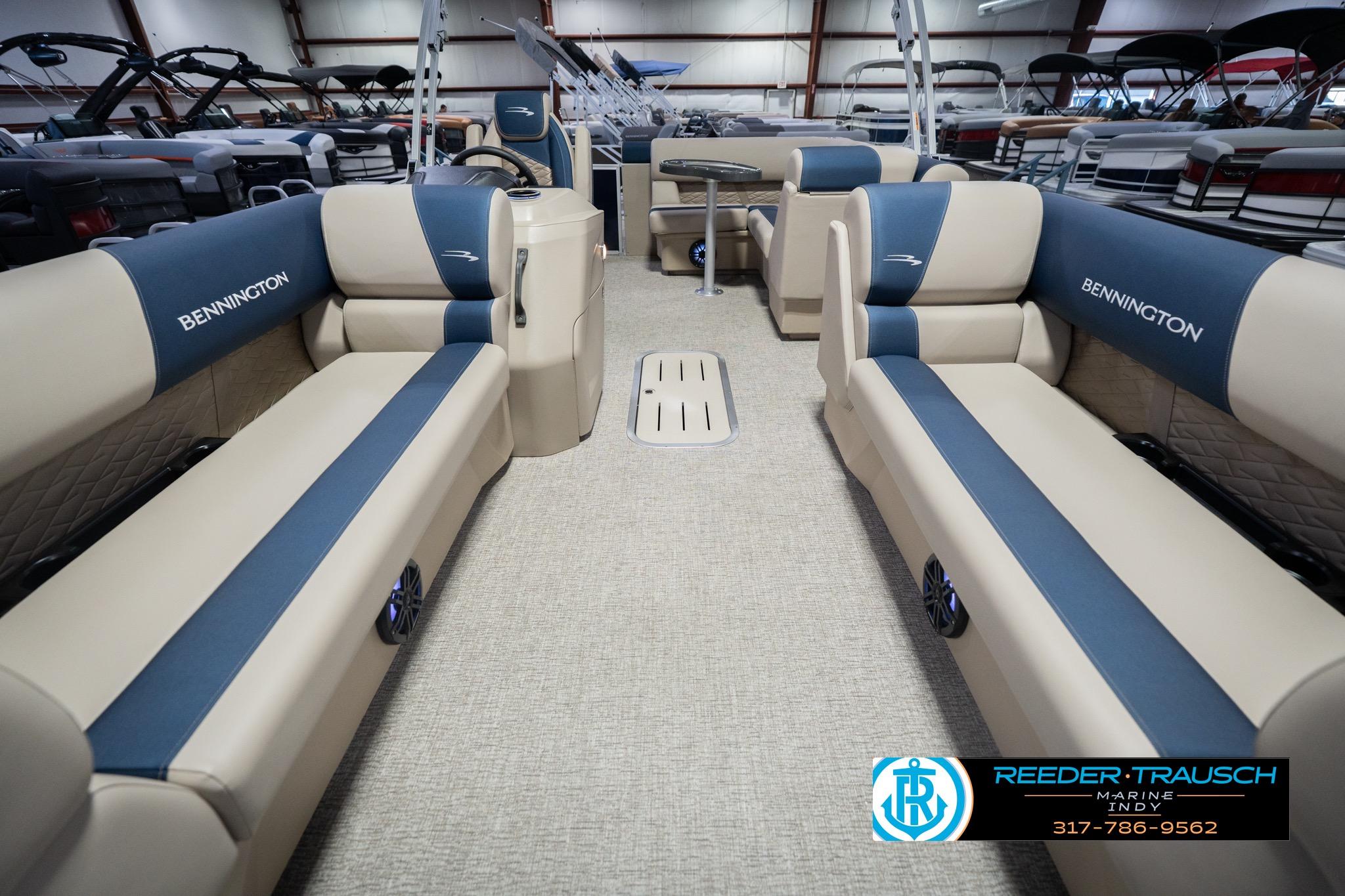 2026 Bennington 21 SLJ pontoon boat interior with beige and blue seating.