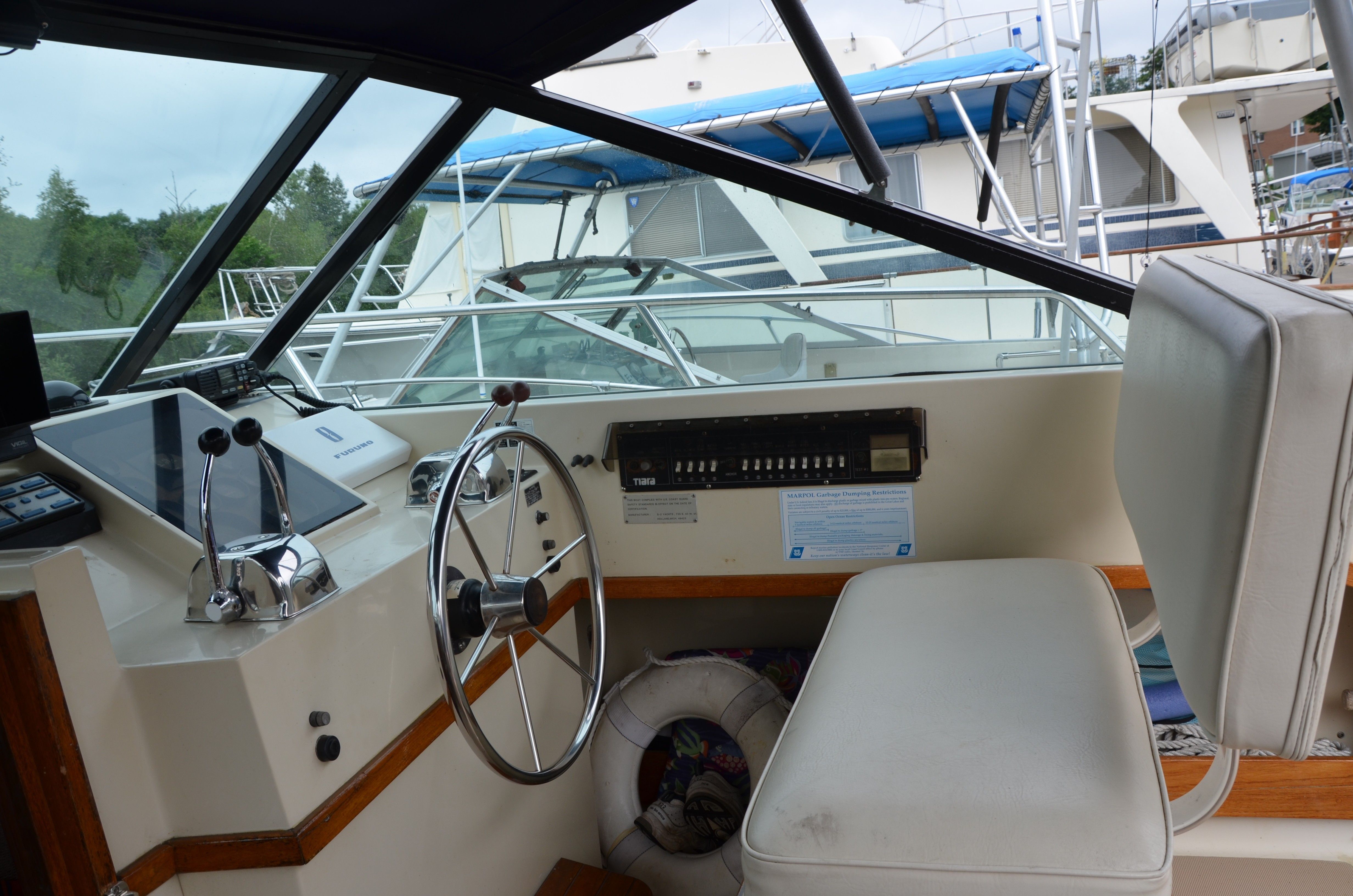 Interior of a 1985 Tiara Yachts 3100 Open, helm station view.