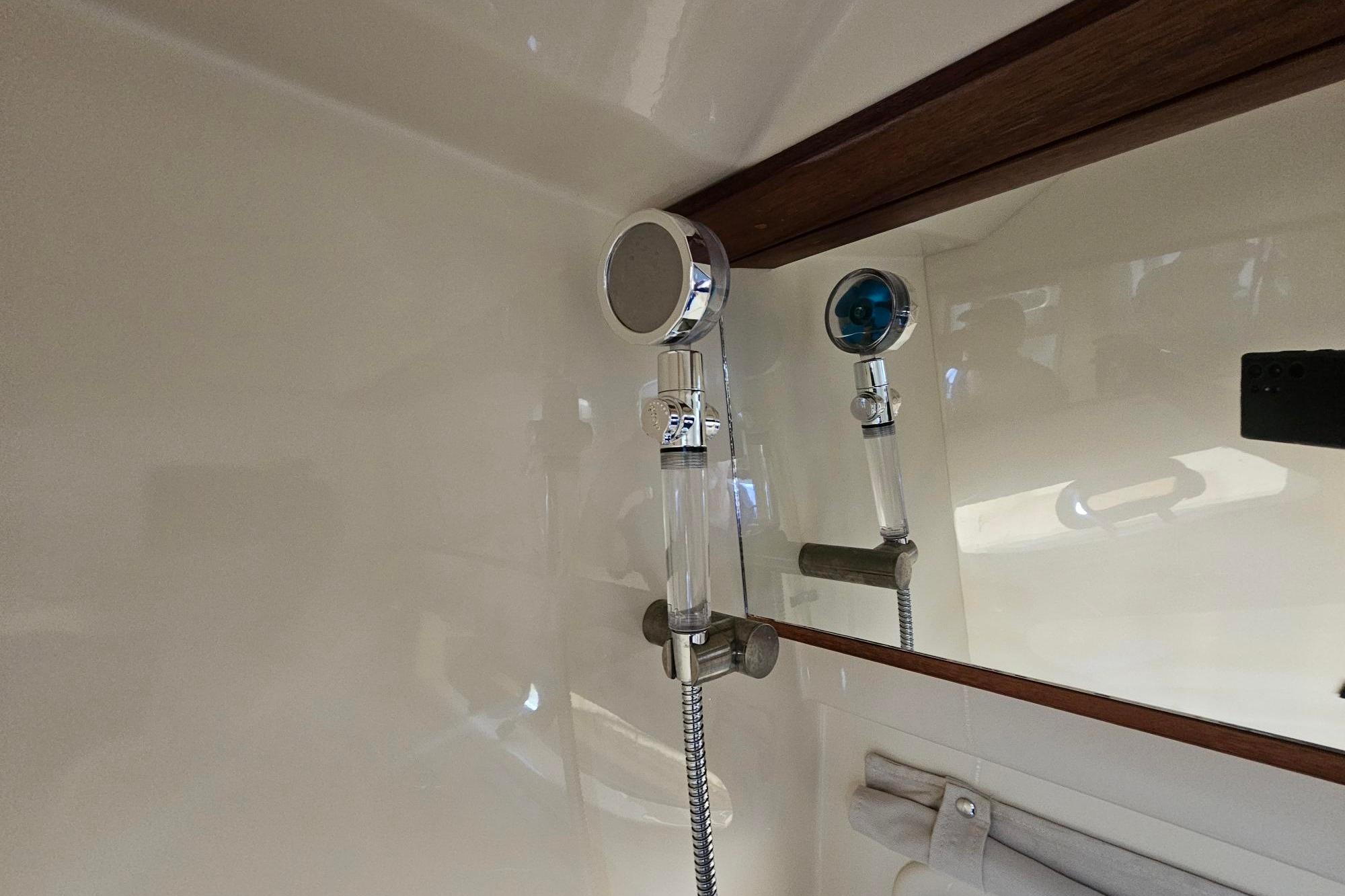 Shower area in 2016 Sea Ray Sundancer 350 yacht, featuring modern fixtures and sleek design.