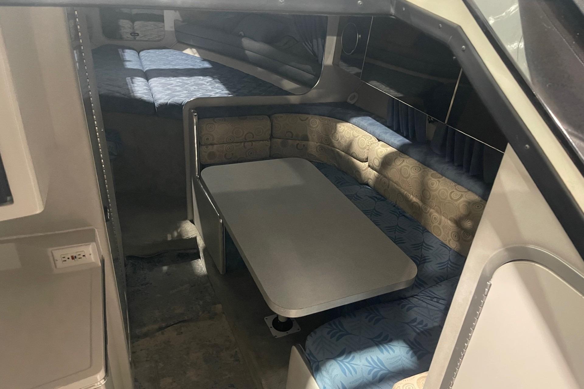 1992 Chaparral Signature 30 interior with dining area and sleeping quarters.