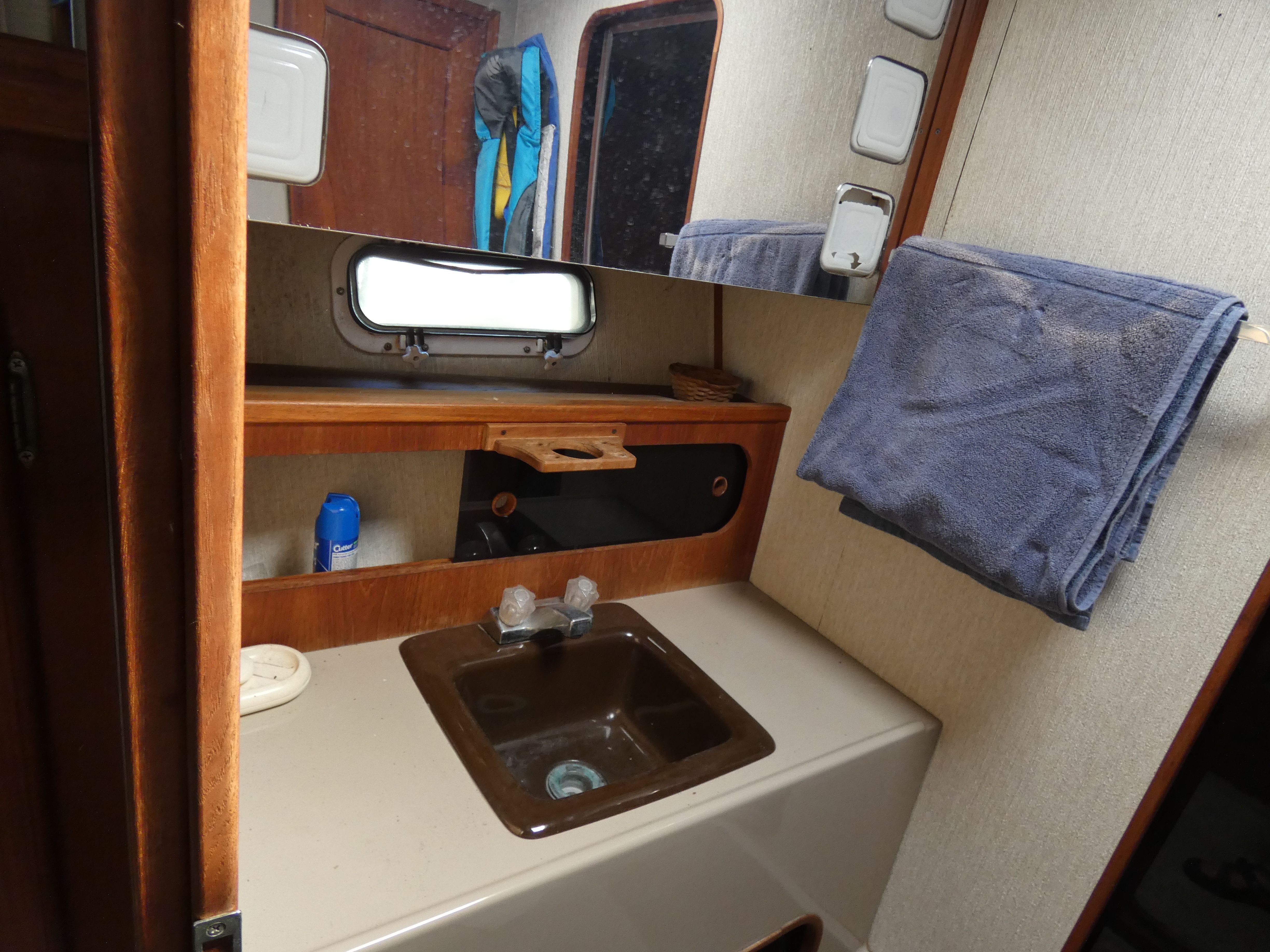 1984 Bayliner 3870 Motoryacht bathroom with sink and mirror.