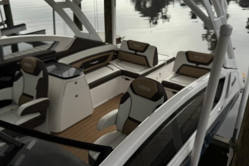 2023 Yamaha 275SDX boat interior with luxurious seating and sleek design.