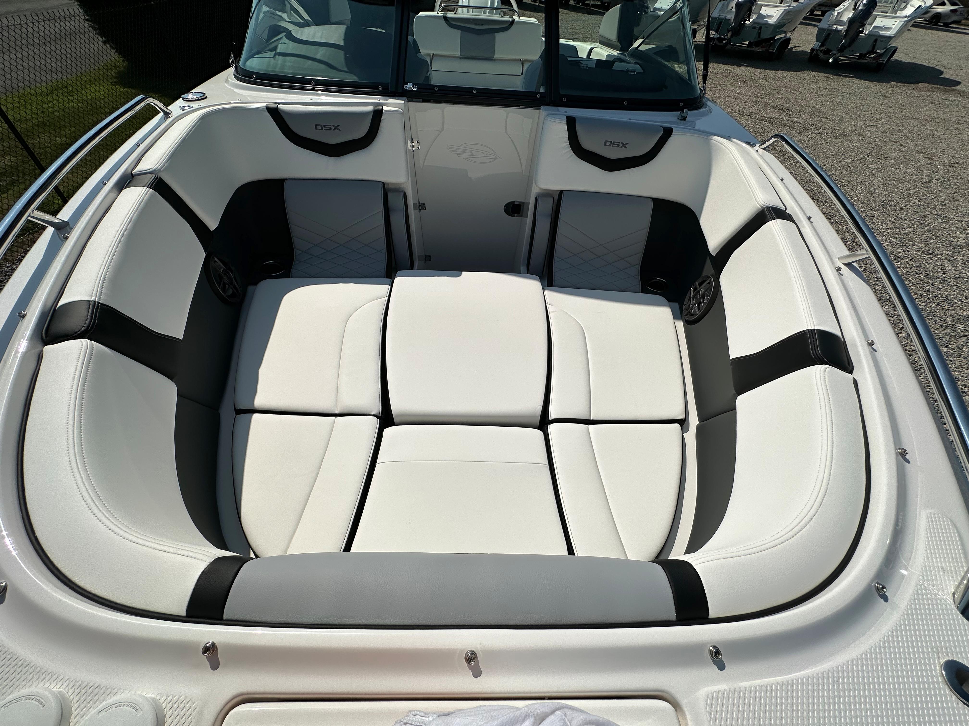 2023 Chaparral 270 OSX boat interior with white cushioned seating.