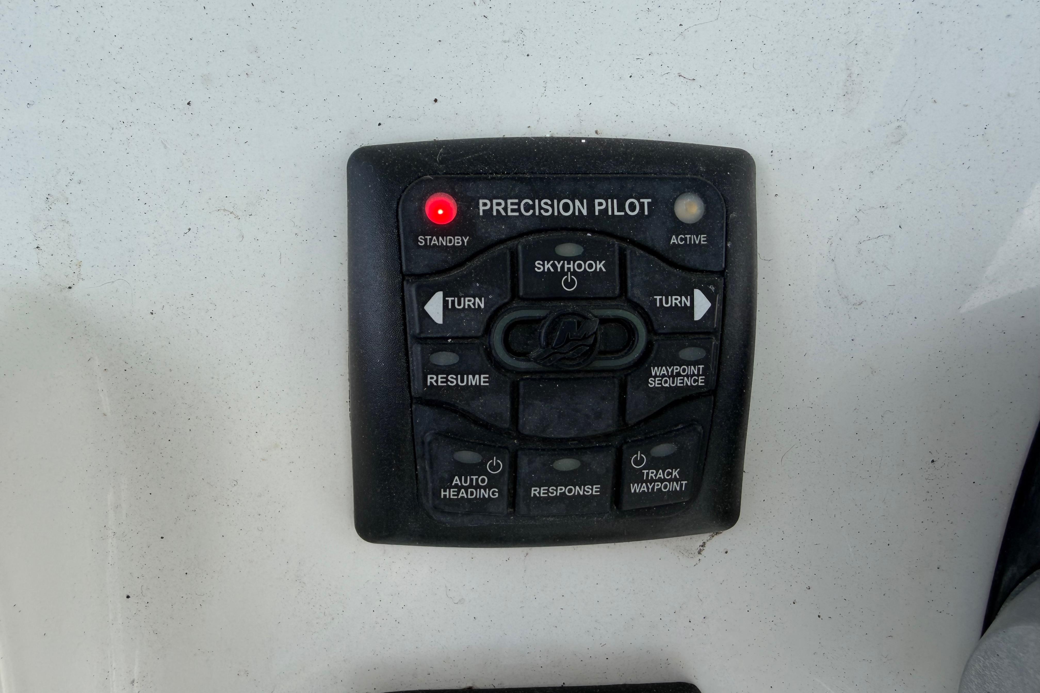 Control panel of a 2017 Mako 284 Center Console boat with Precision Pilot system.
