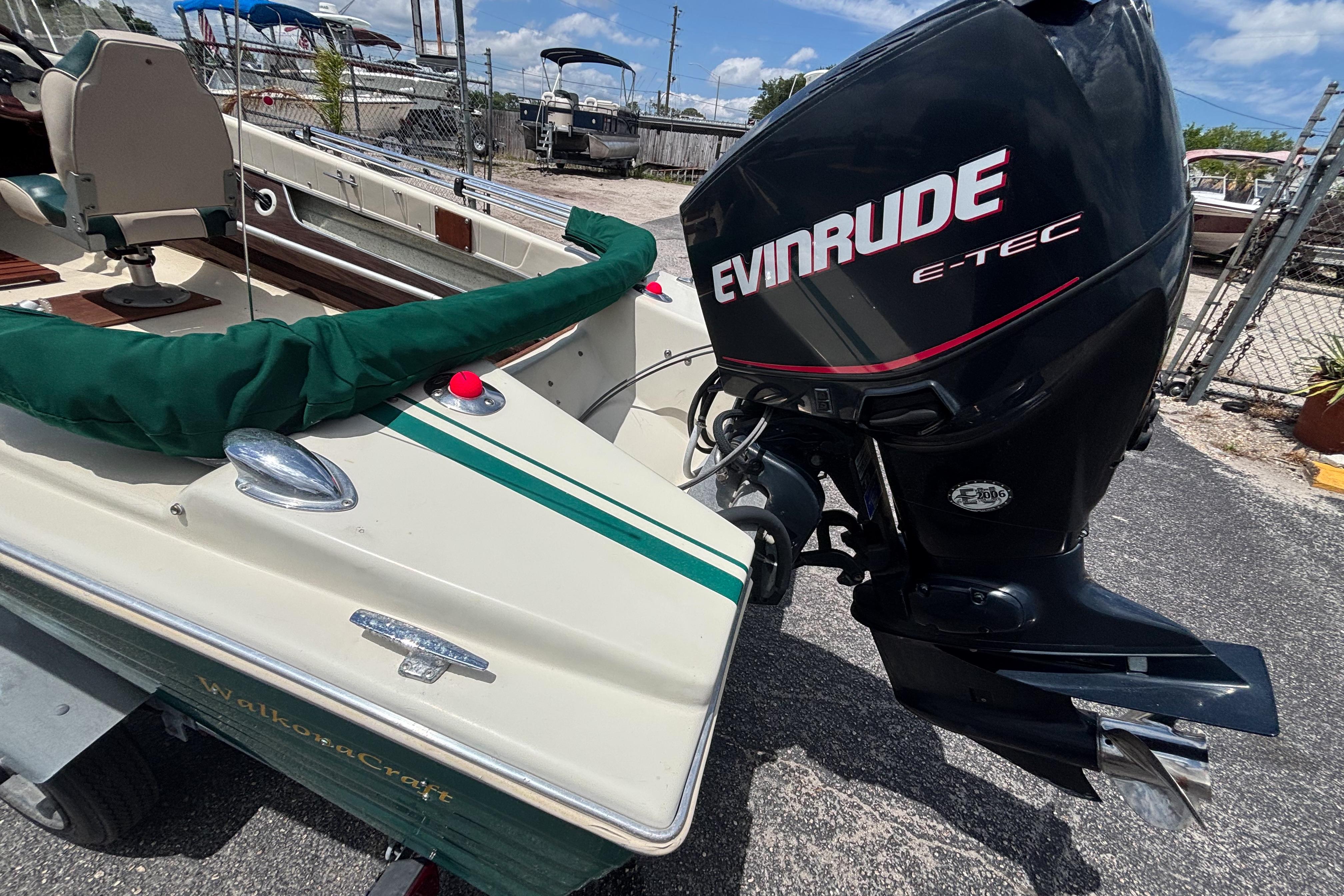 Vintage 1966 Mohawk 15 boat with Evinrude E-TEC outboard motor.