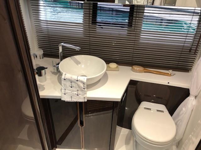 Luxurious bathroom in 2018 Galeon 485 yacht with modern fixtures and elegant design.