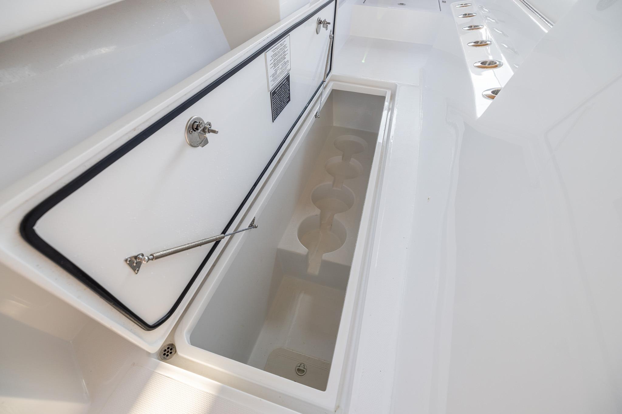 Open storage compartment on 2026 Front Runner 37 Catamaran, showcasing sleek design and functionality.