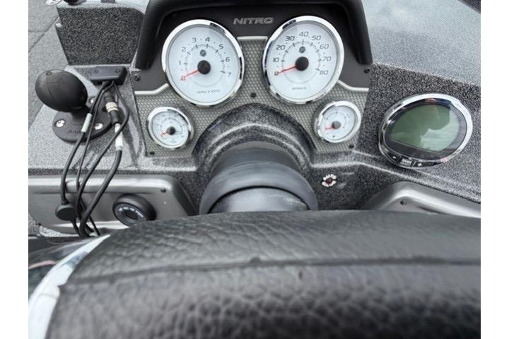 2024 Nitro ZV21 dashboard with gauges and steering wheel, showcasing modern boat controls.
