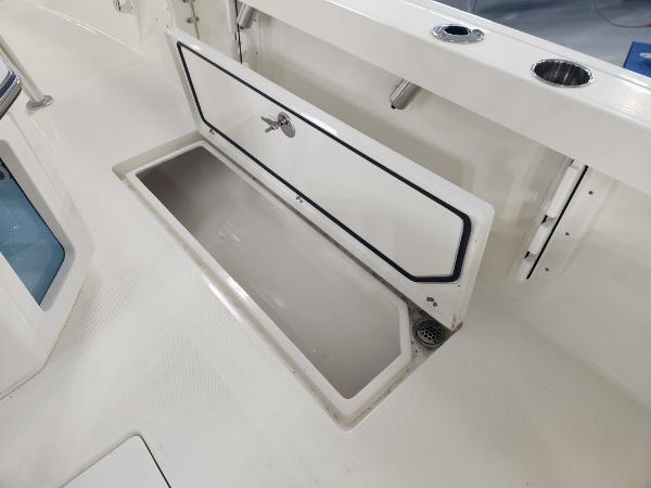 2025 Pathfinder 2400 Open boat storage compartment with open hatch.