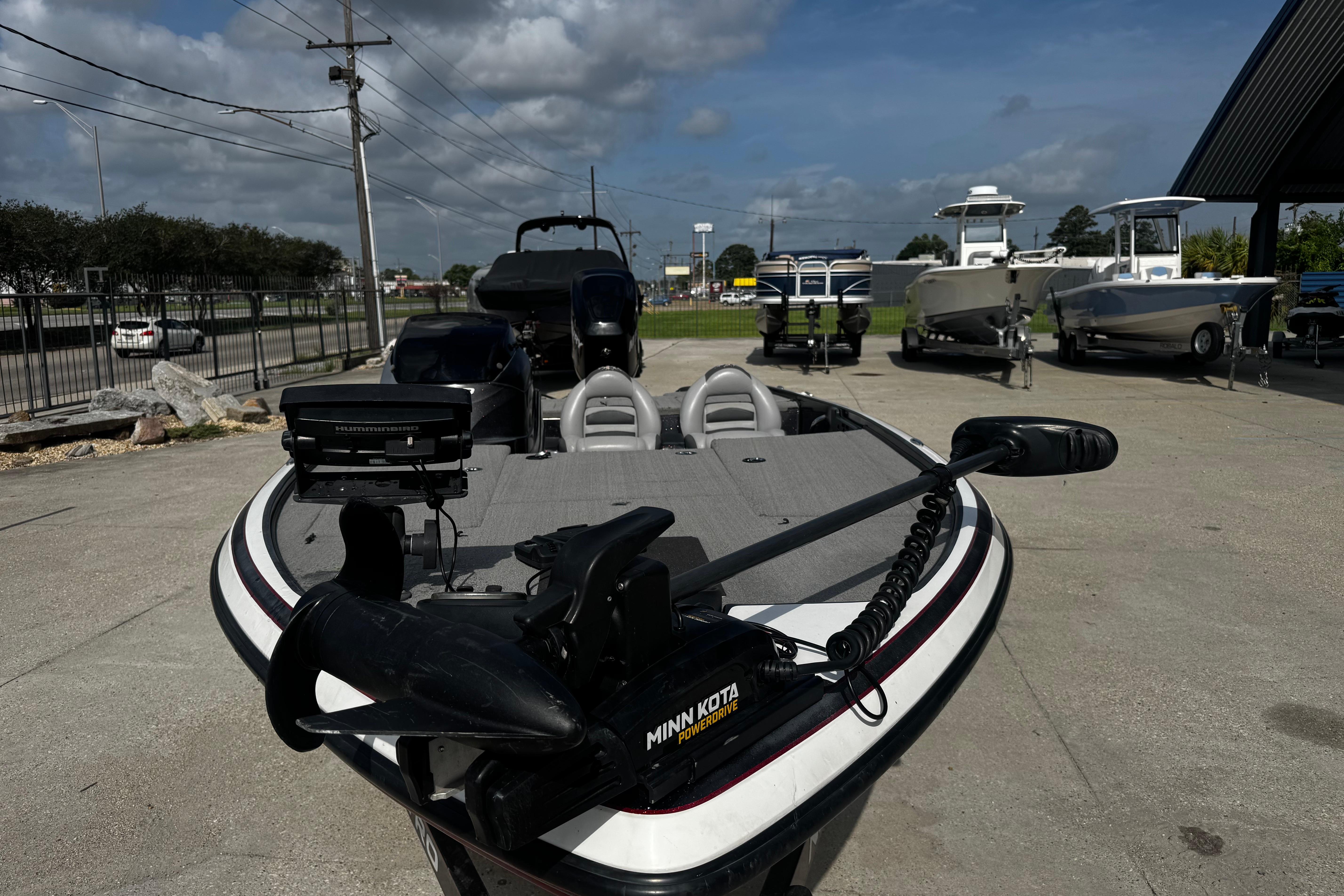 2012 Nitro Z-7 boat with Minn Kota trolling motor in a dealership lot.