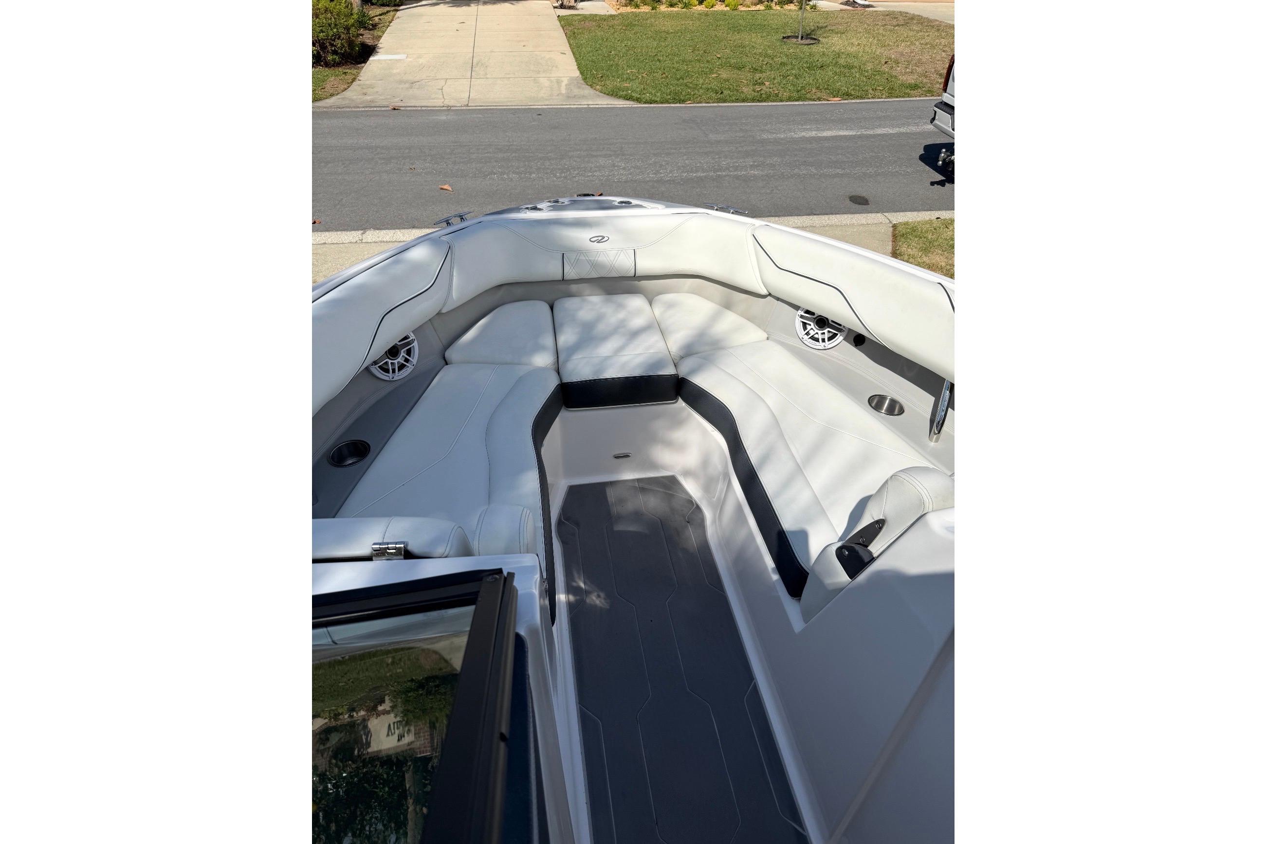 2020 Regal LX4 boat interior with white seating and cup holders.