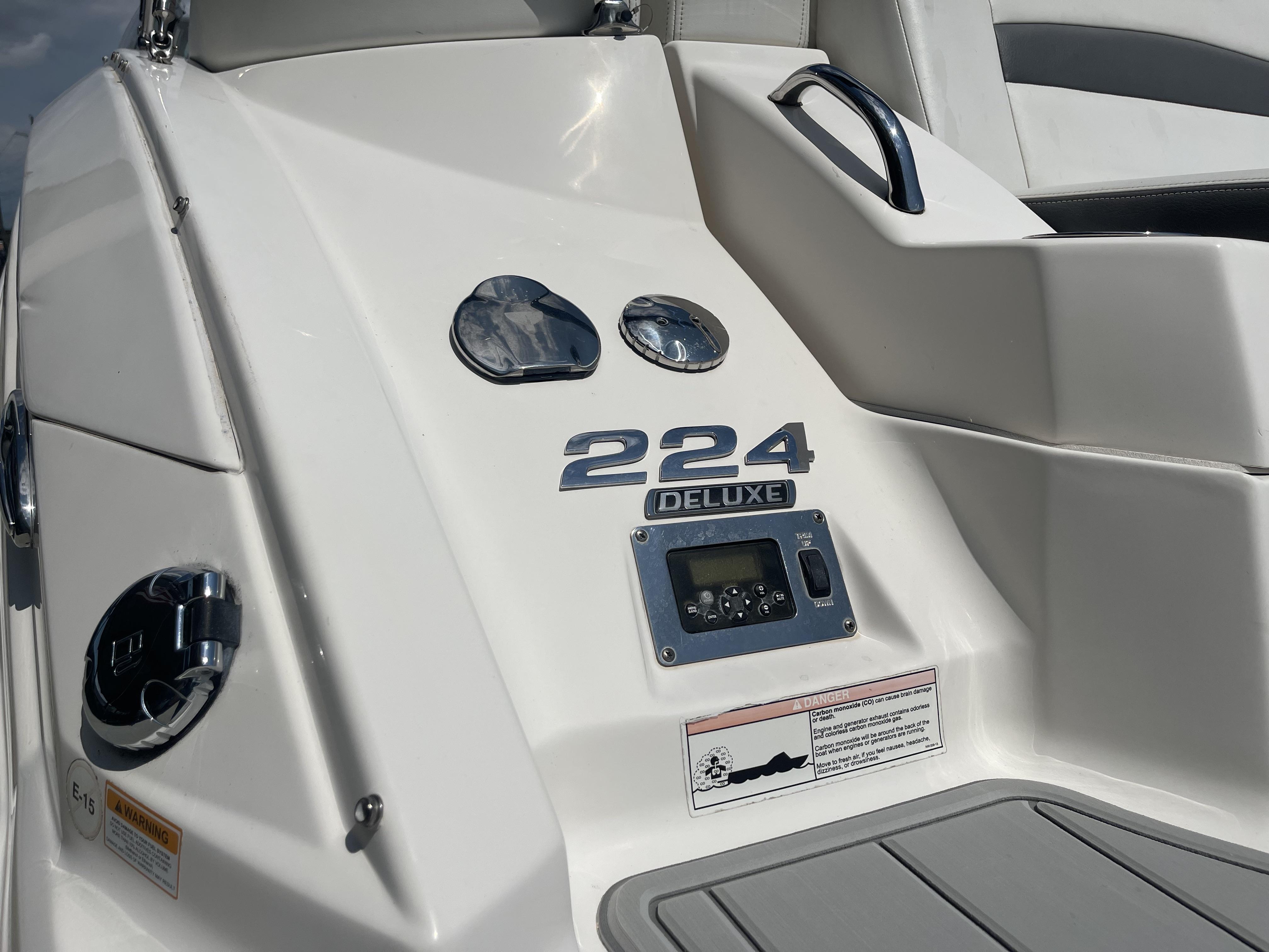 2014 Chaparral Sunesta 224 Deluxe boat dashboard with controls and branding.