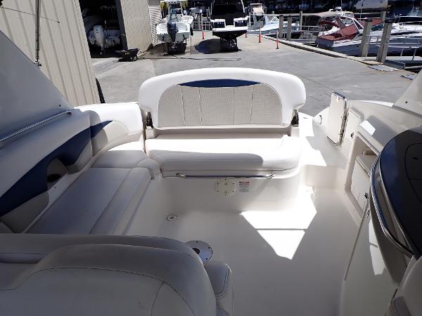 2011 Chaparral 287 SSX boat interior with white seating and dockside view.