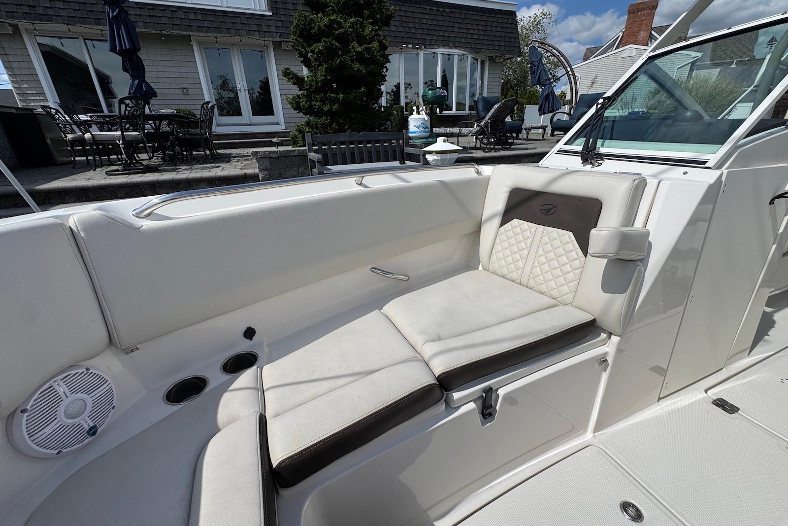 2022 Sailfish 276 DC boat interior with cushioned seating and modern design.