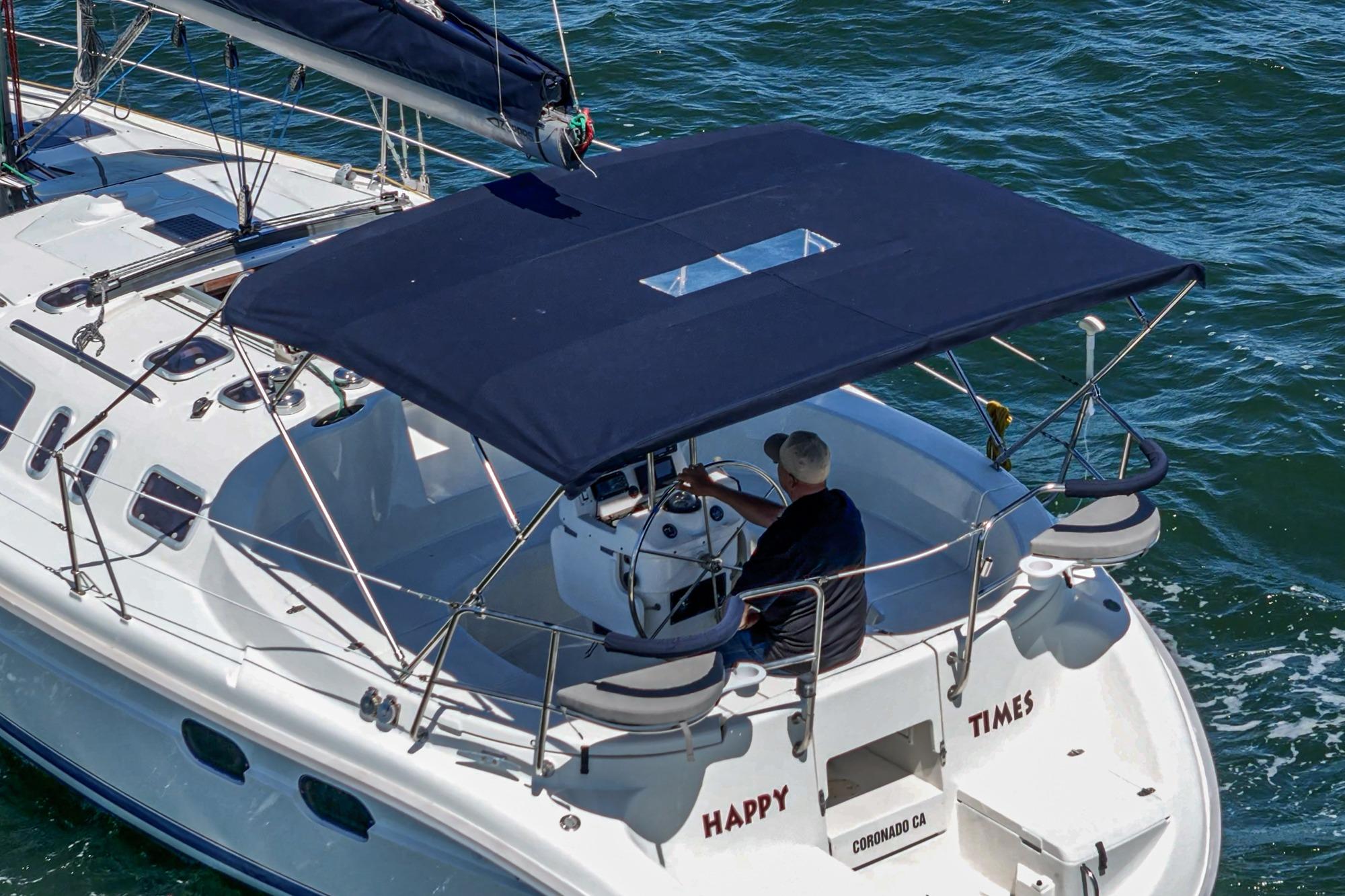 Hunter 376 sailboat from 1996, named "Happy Times," cruising on the water.