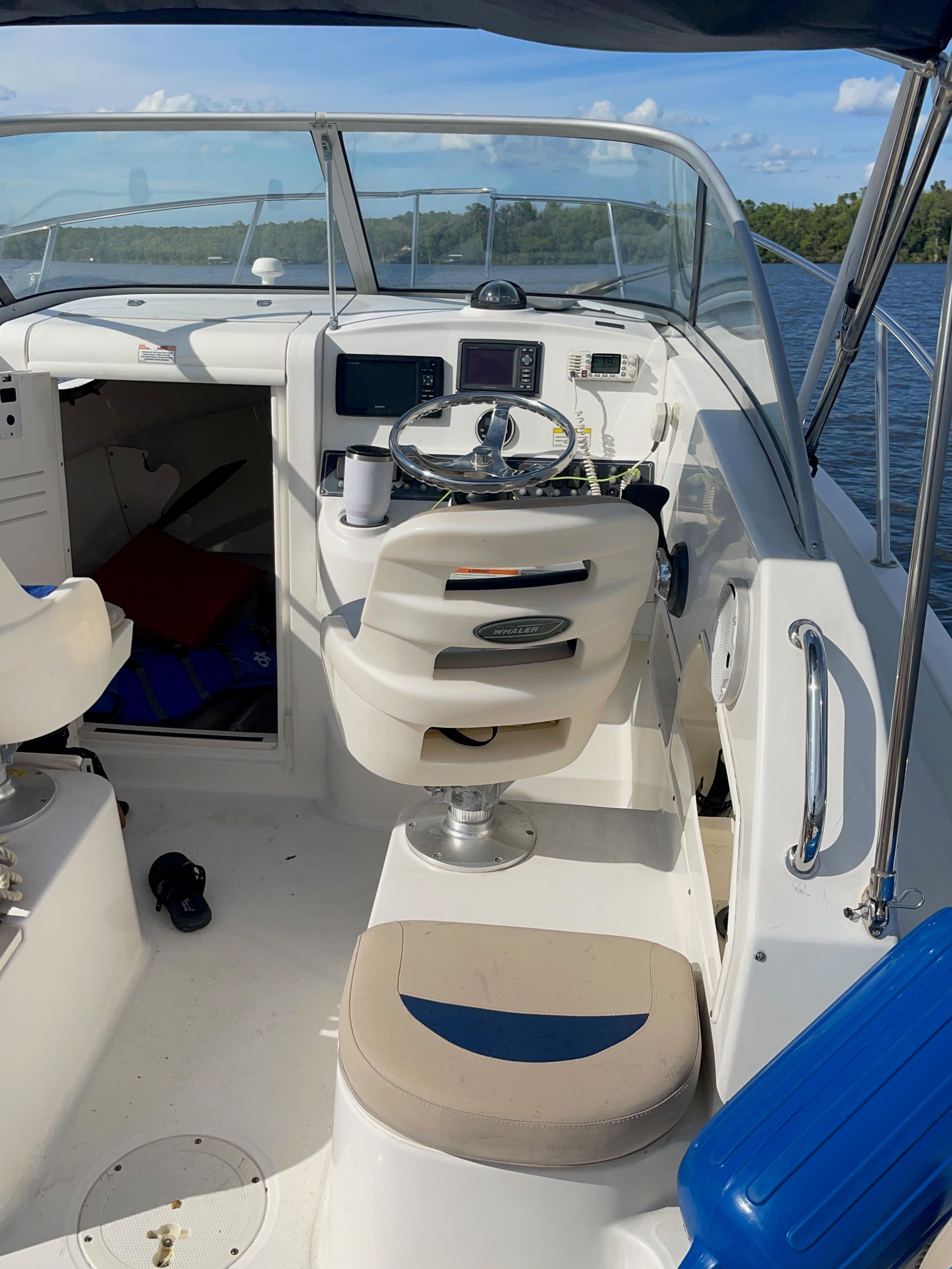 Interior of a 2010 Boston Whaler 235 Conquest boat on the water.