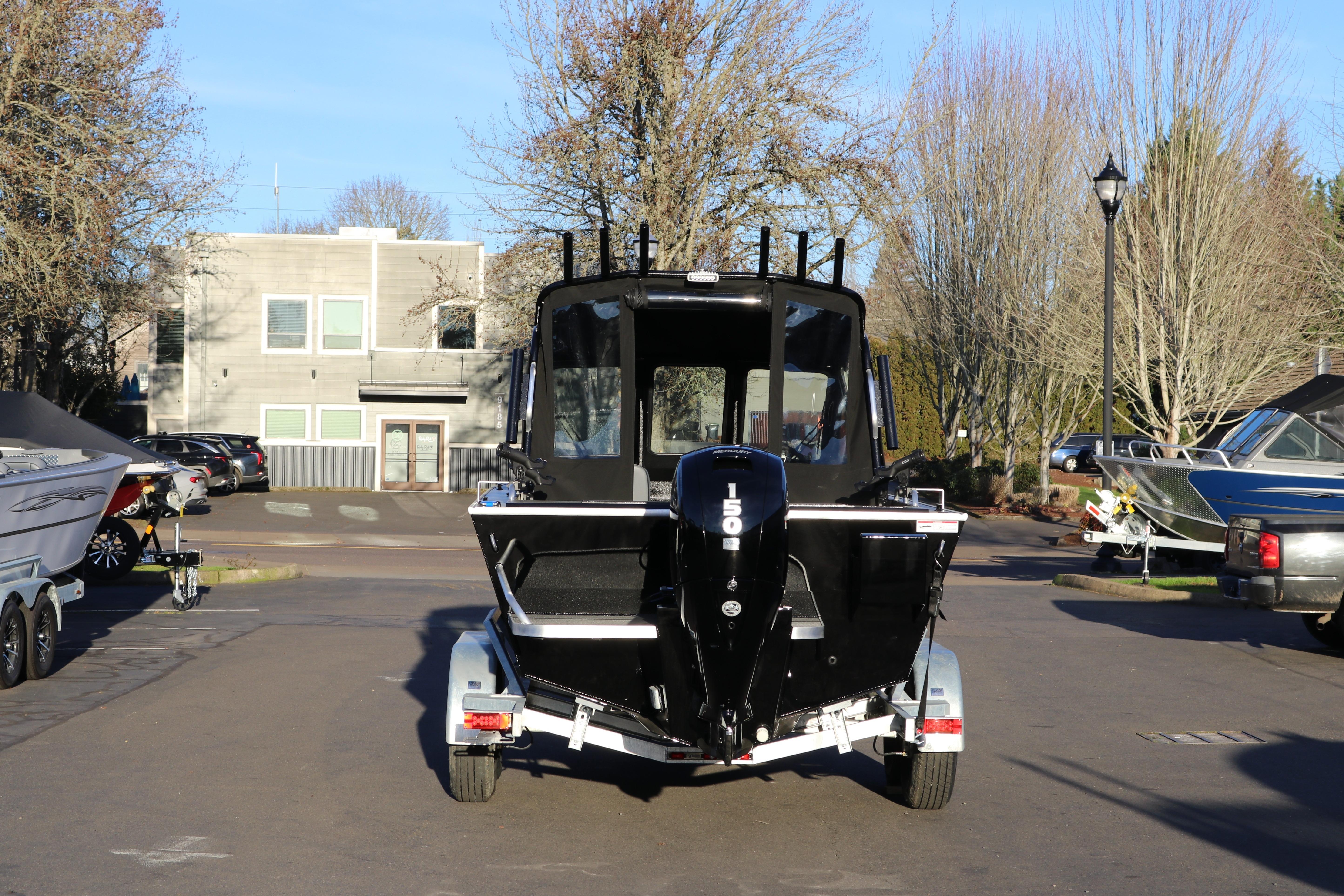 2026 Alumaweld Stryker X202 boat on trailer, parked outdoors.