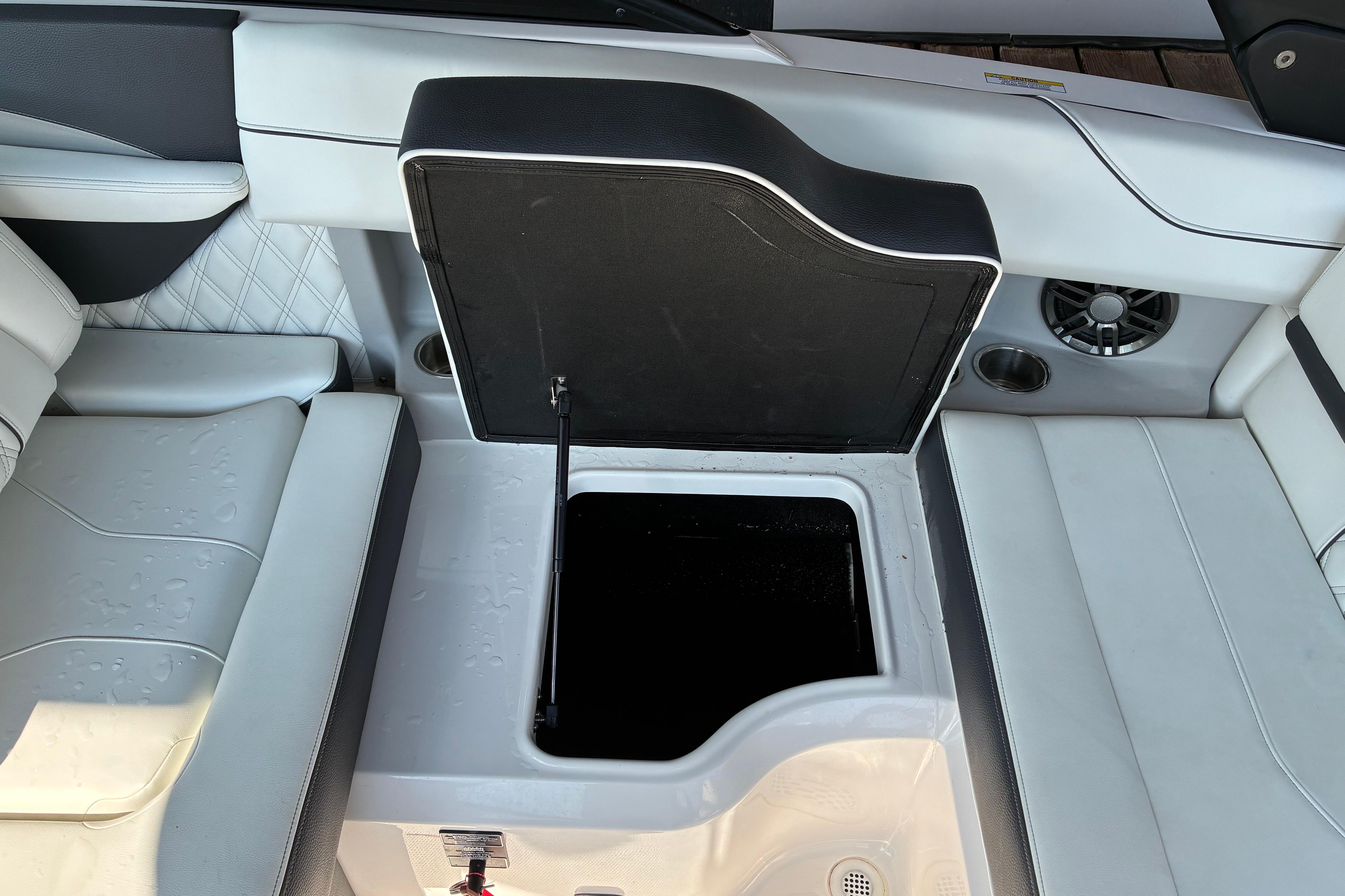 2025 Regal LS2 boat interior with open storage compartment and sleek seating design.