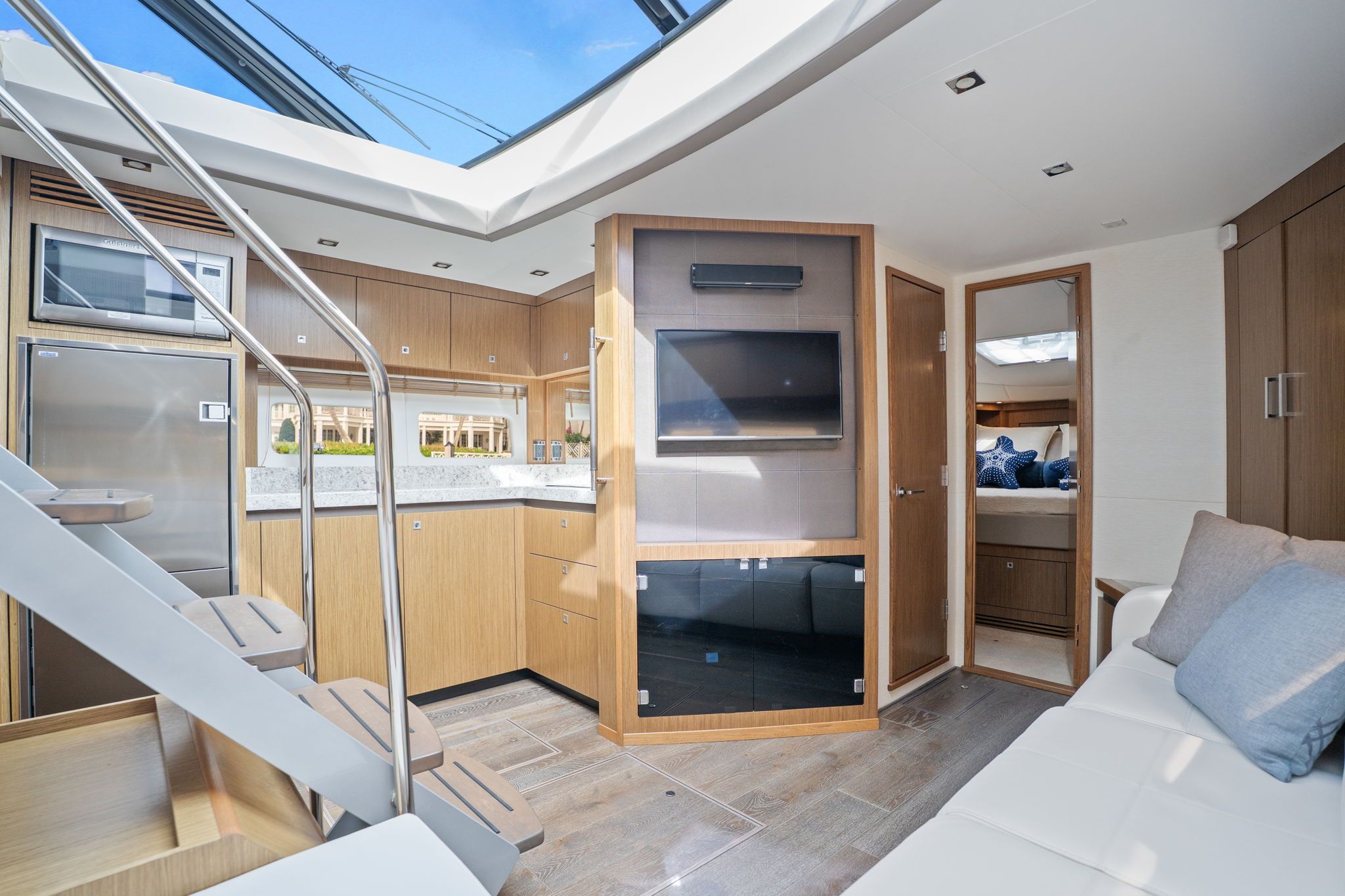 Interior of the 2017 Sea Ray Sundancer 510 with modern kitchen and cozy living area.