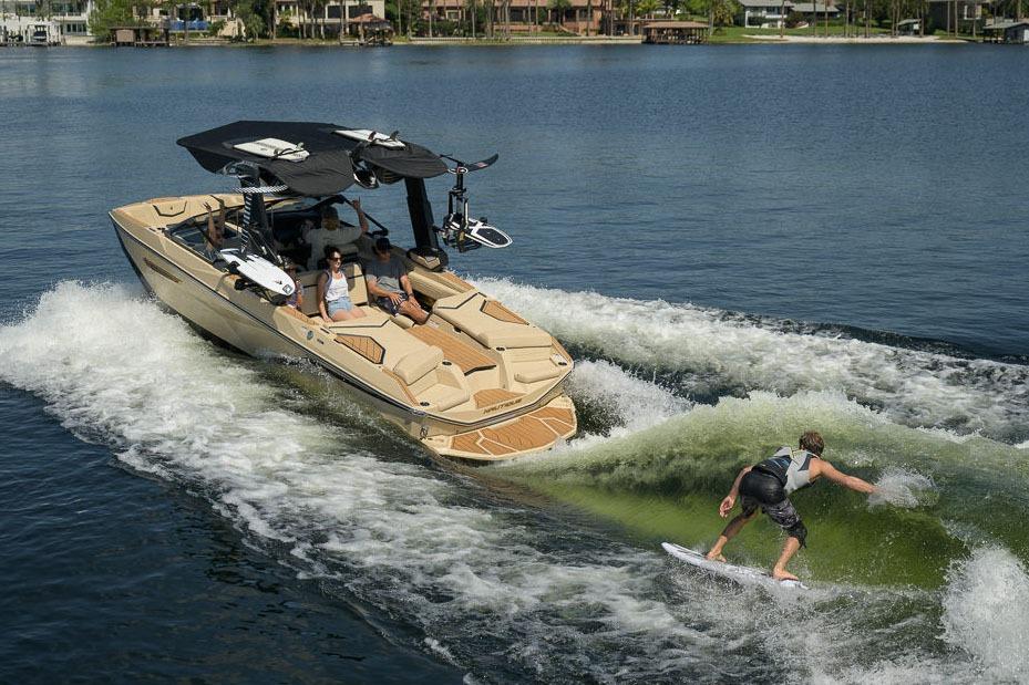 Manufacturer Provided Image: 2026 Nautique Super Air Nautique G23 towing a wakeboarder on a sunny lake.
