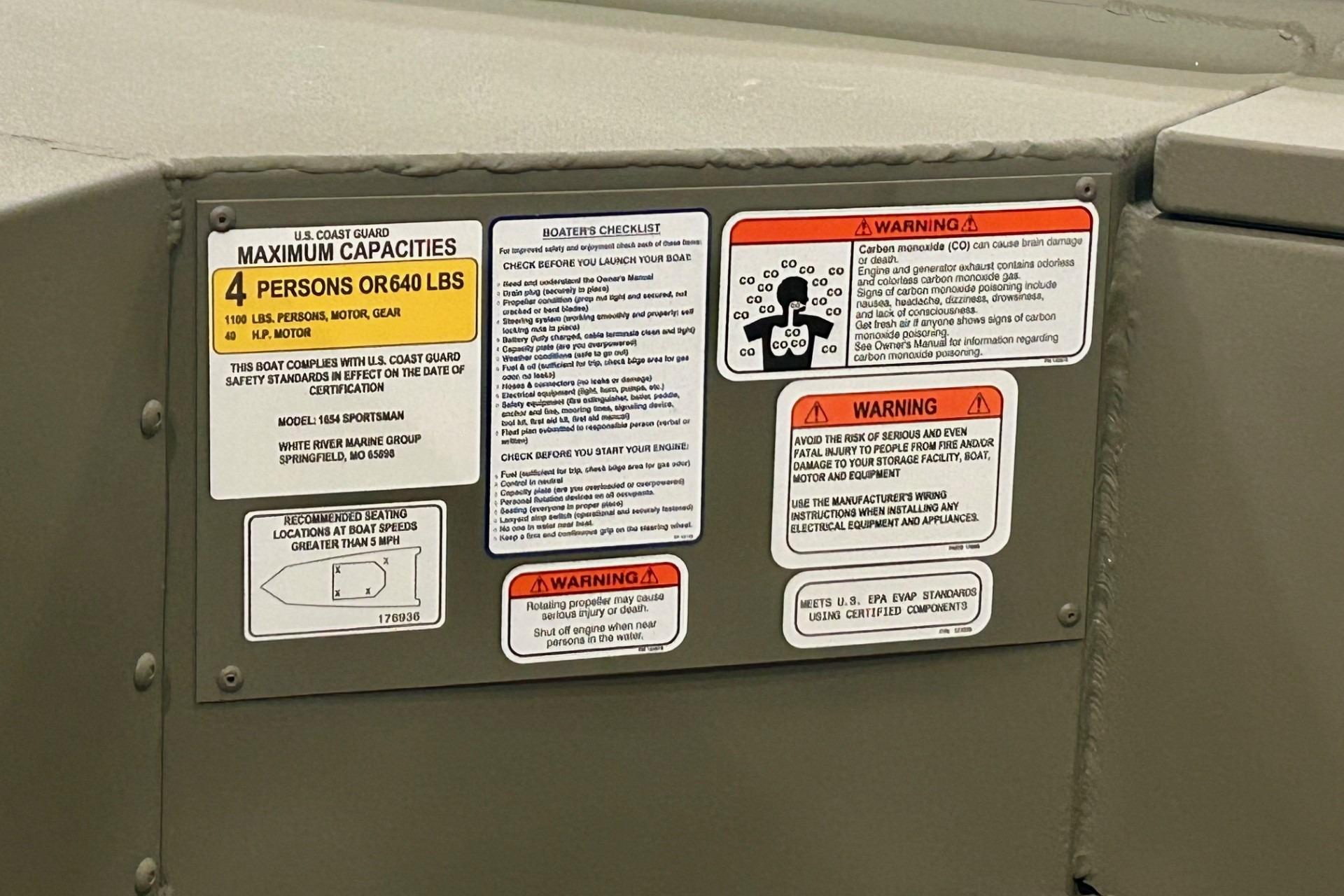 Safety and capacity labels on 2026 Tracker Grizzly 10 Jon boat interior.