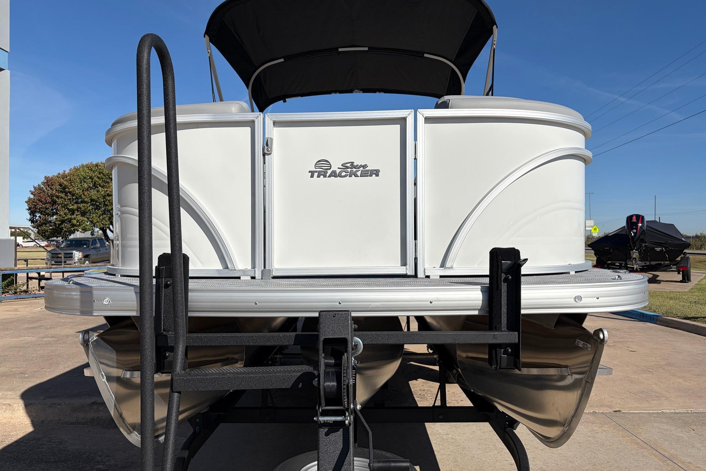 2026 Sun Tracker Party Barge 22 RF XP3 pontoon boat on trailer, front view.