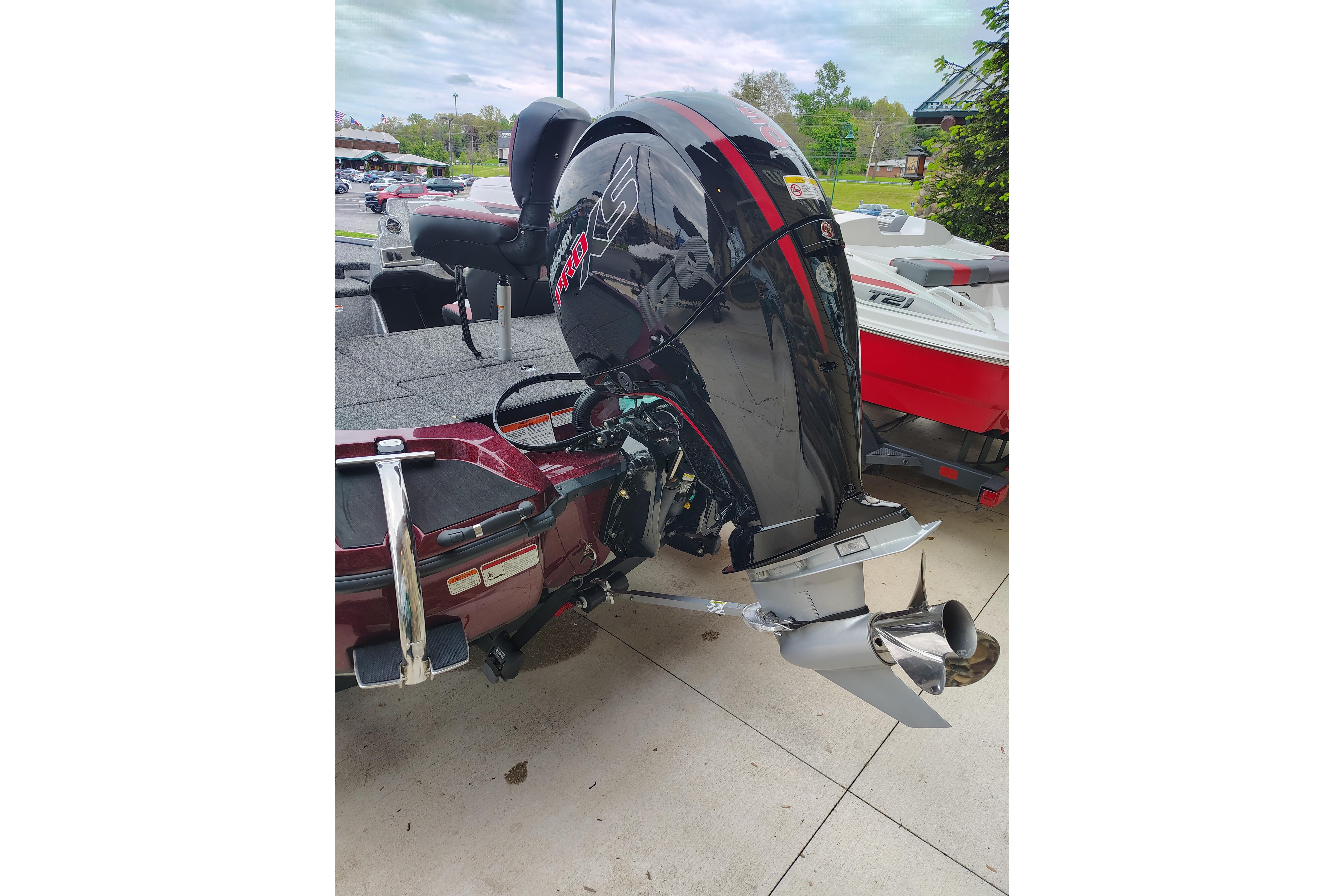 2026 Nitro Z18 Pro boat engine, sleek design, parked outdoors on a concrete surface.