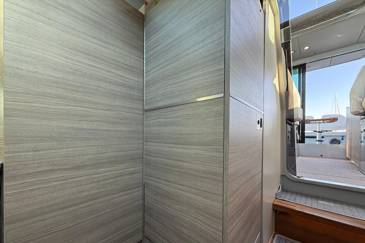 Interior view of 2024 Saxdor 320 GTC yacht, featuring modern wood paneling and sleek design.