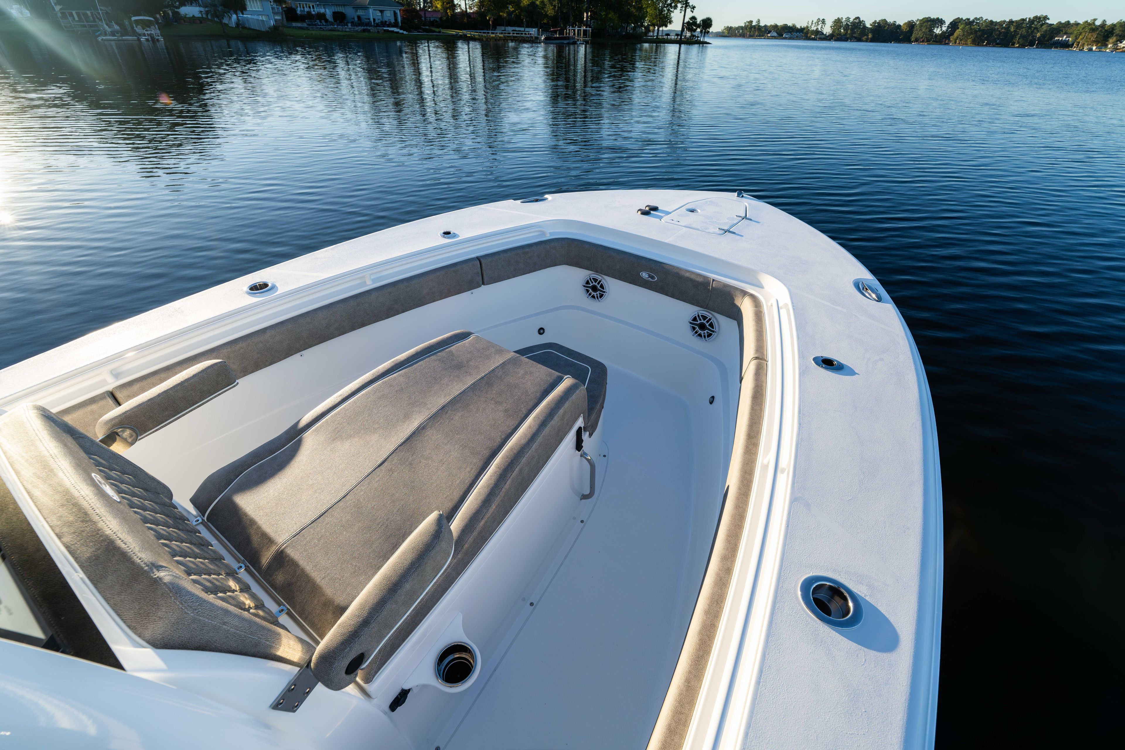 2026 Sea Hunt Ultra 275 Coffin Box boat on calm water, showcasing spacious deck.