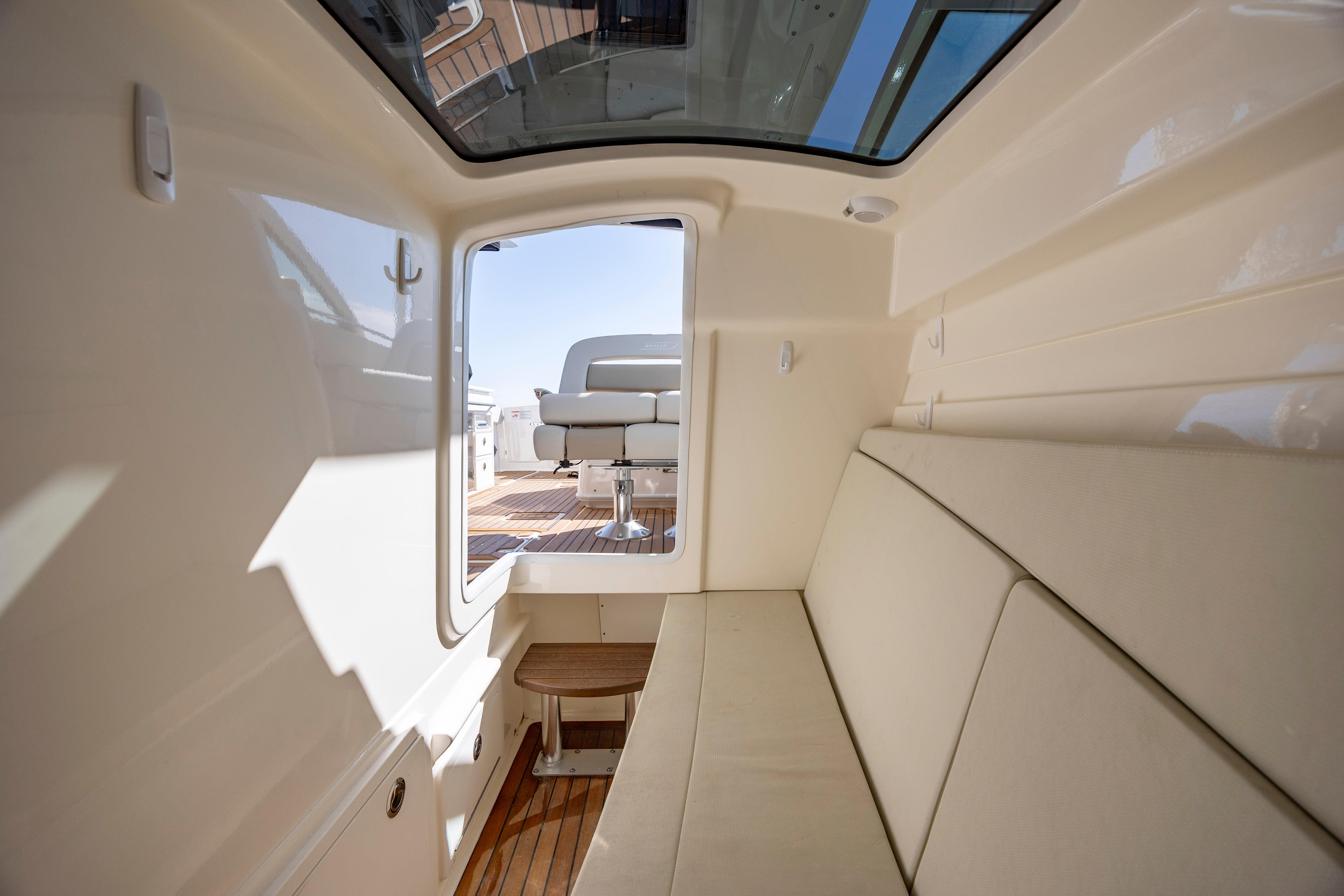 Interior view of 2023 Boston Whaler 320 Vantage, featuring comfortable seating and sleek design.