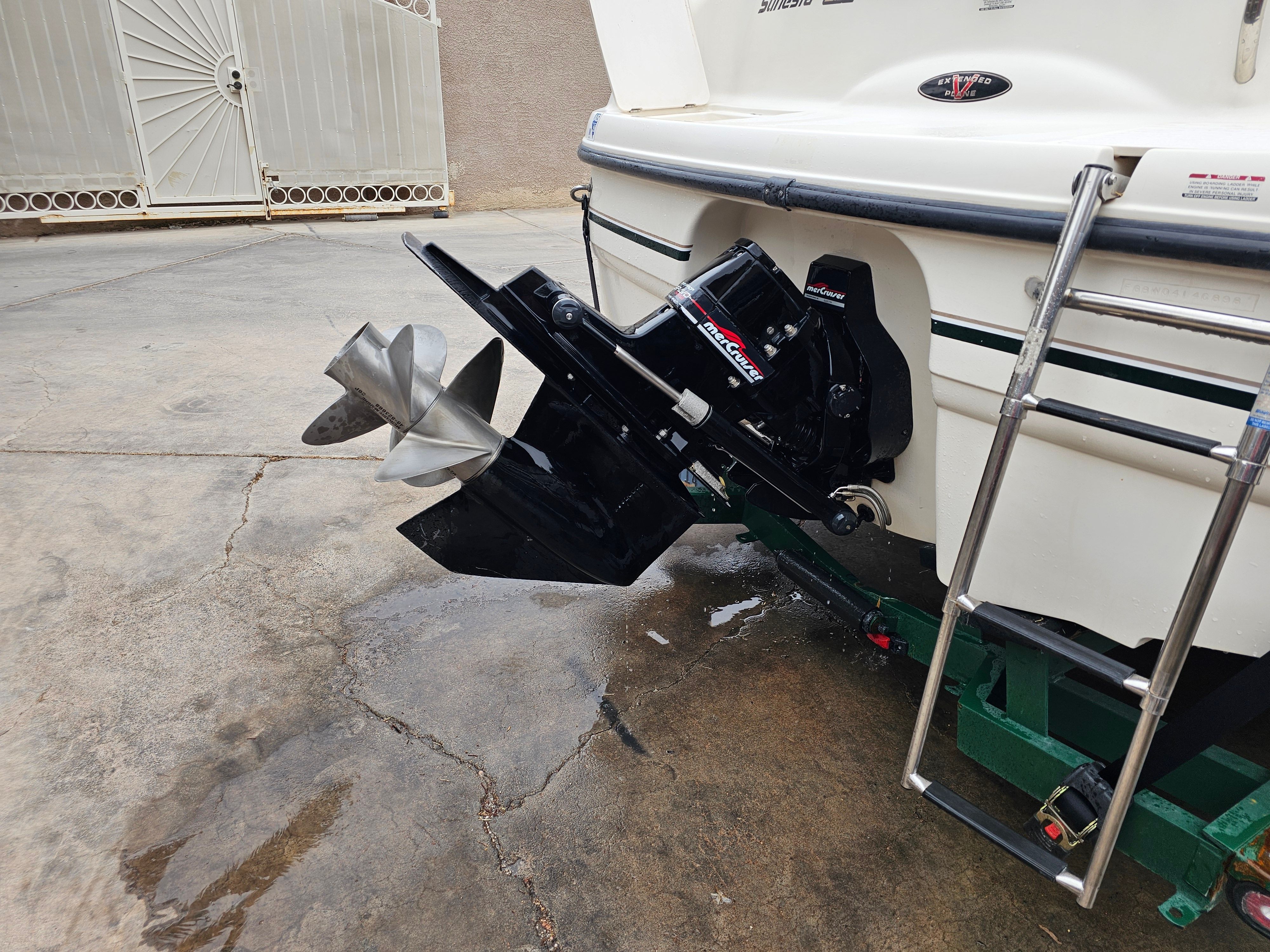 1998 Chaparral Sunesta 252 Special Edition with outboard motor and ladder.