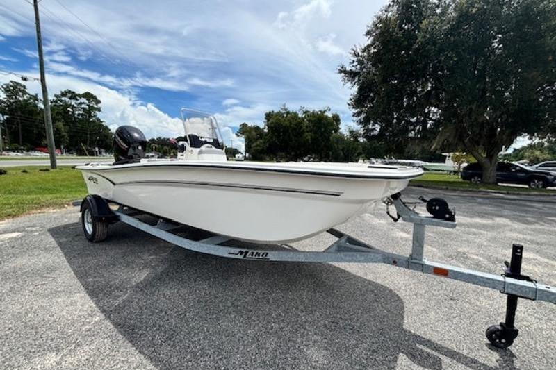 2026 Mako Pro Skiff 17 CC boat on trailer, parked outdoors.