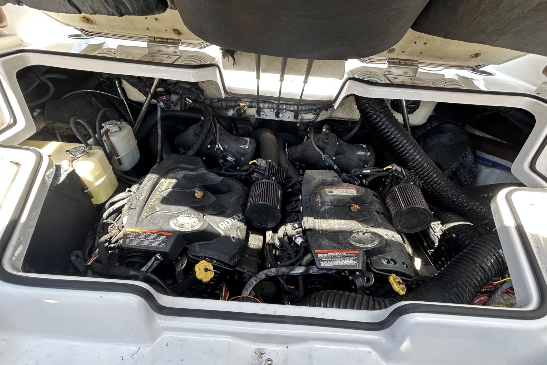 Engine compartment of a 2019 Scarab 255 ID boat, featuring dual Rotax engines.