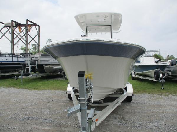 2025 Sea Fox 228 Commander boat on trailer, front view, parked outdoors.