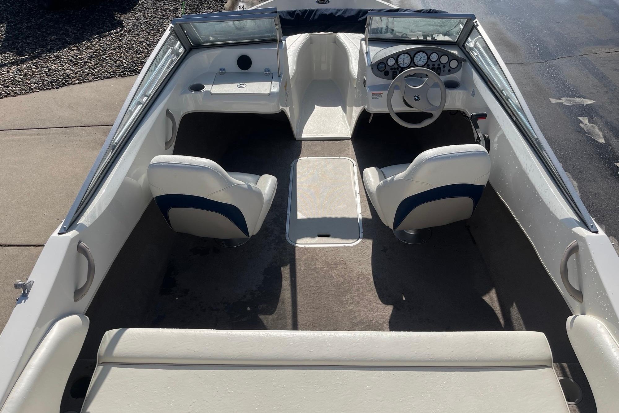 2013 Stingray 191 RX boat interior with steering wheel and seating.