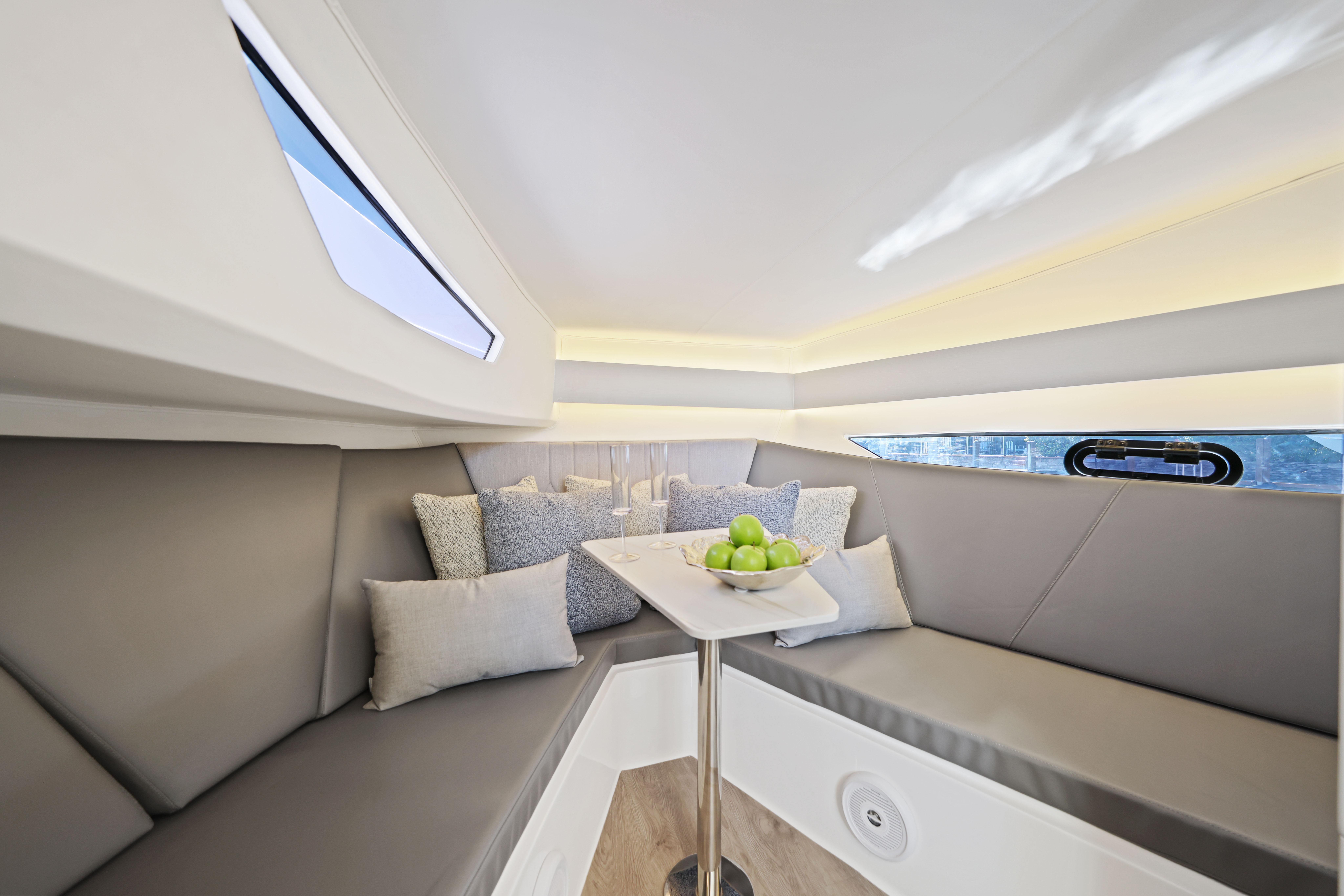 Luxurious interior of 2025 Valiatt 380 Bowrider with elegant seating and table.