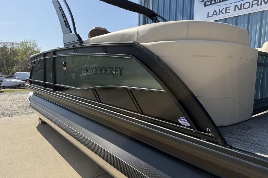 2026 Godfrey Monaco 235 SB pontoon boat, sleek design, displayed outdoors near Lake Norman.